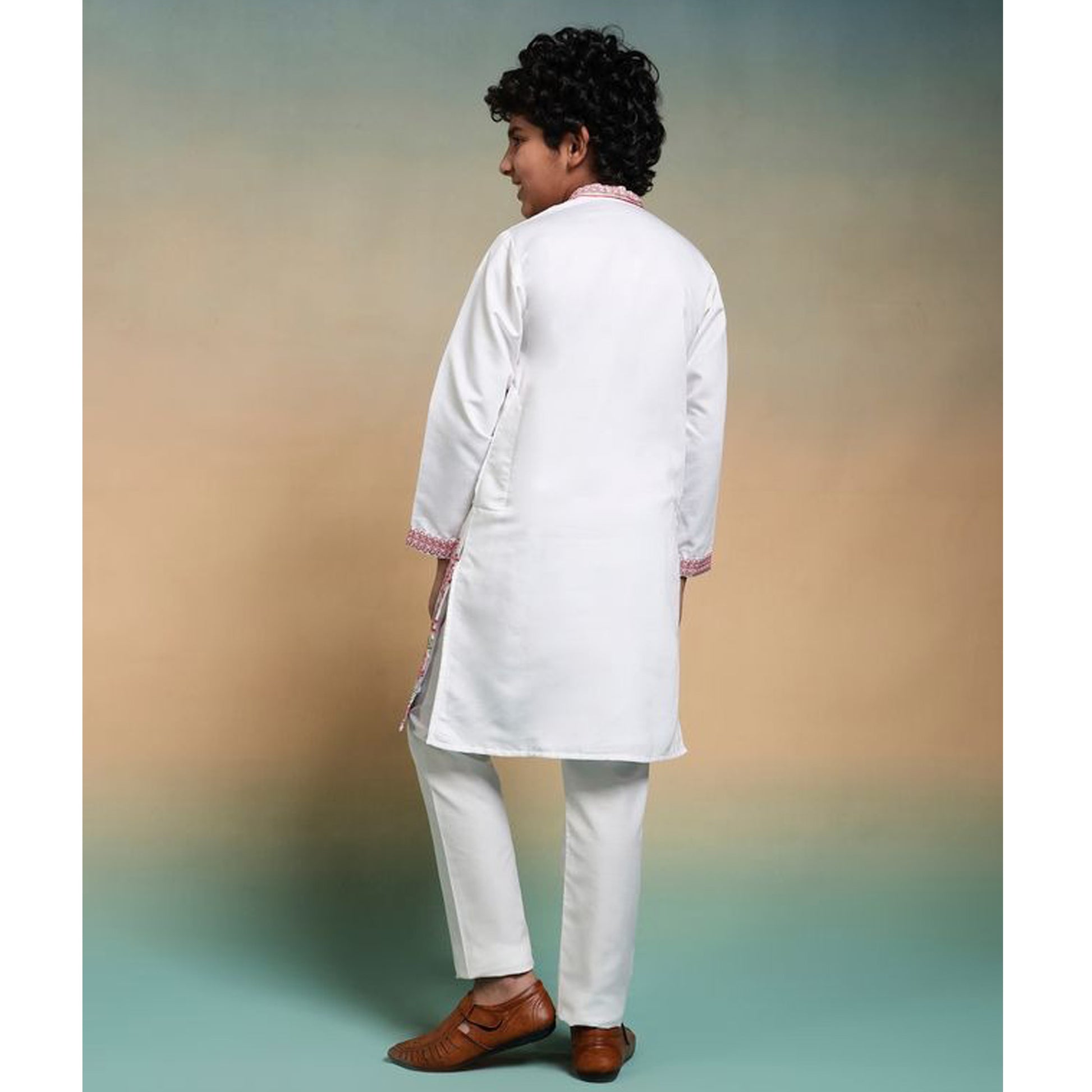 back view of boys kurta white design