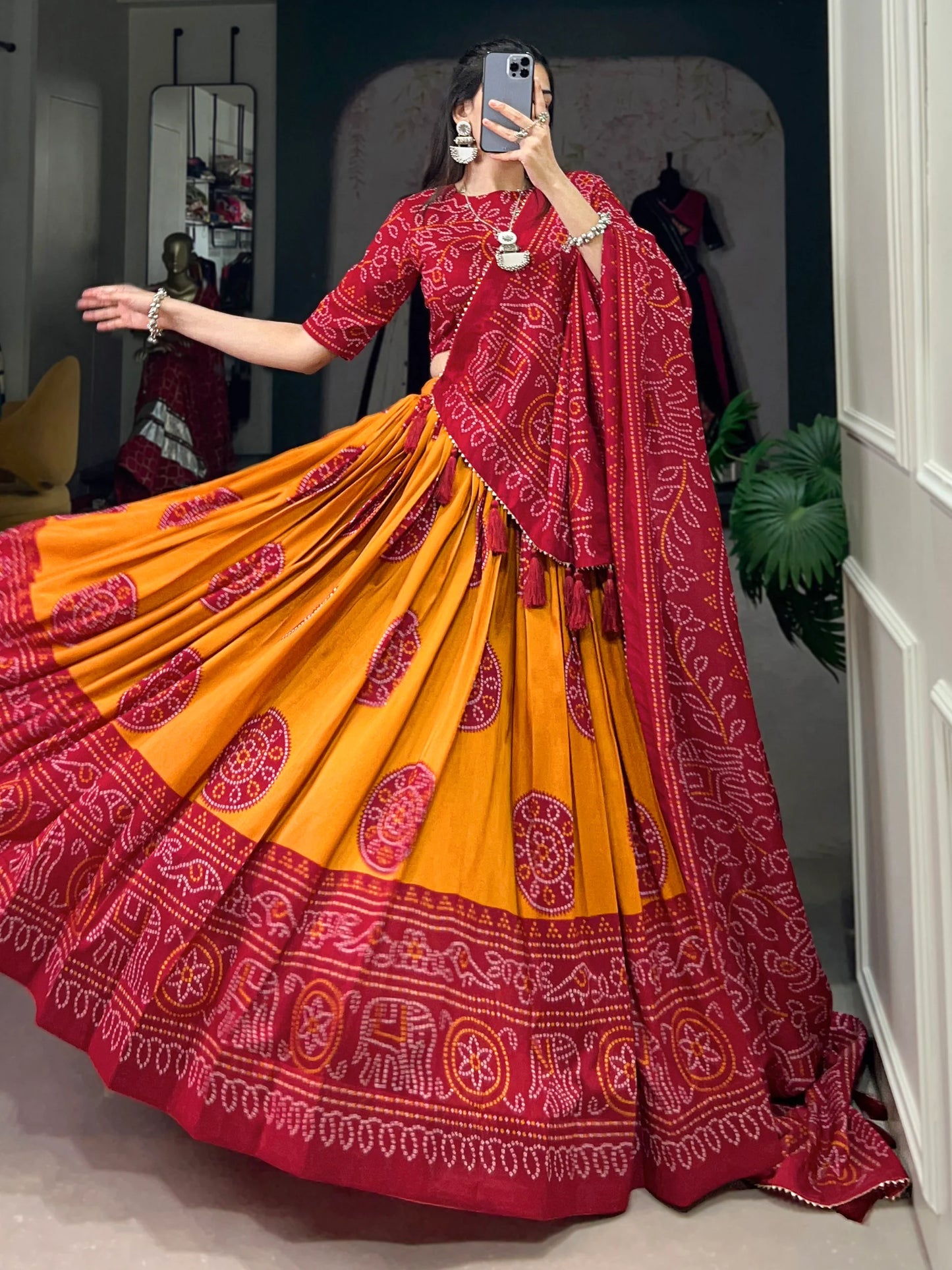 Red lehenga choli skirt flare showcasing digital print patterns