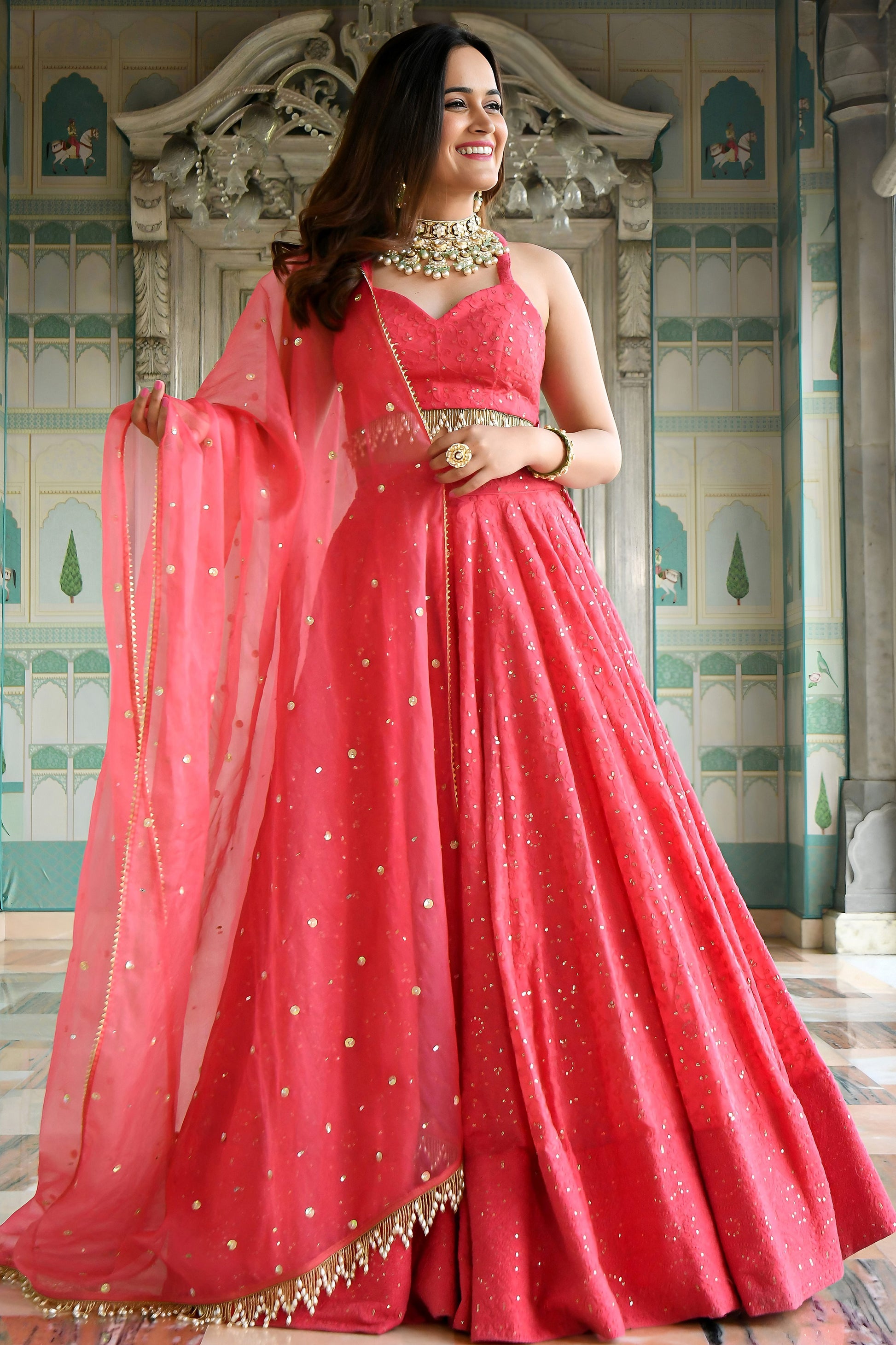 Model wearing Bright Pink Lehenga Choli with sequins embroidery