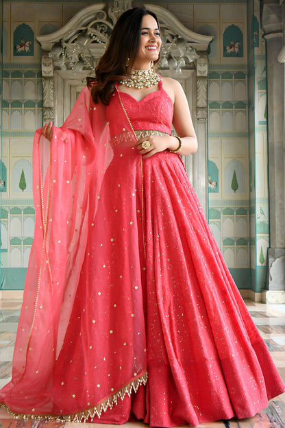 Model wearing Bright Pink Lehenga Choli with sequins embroidery