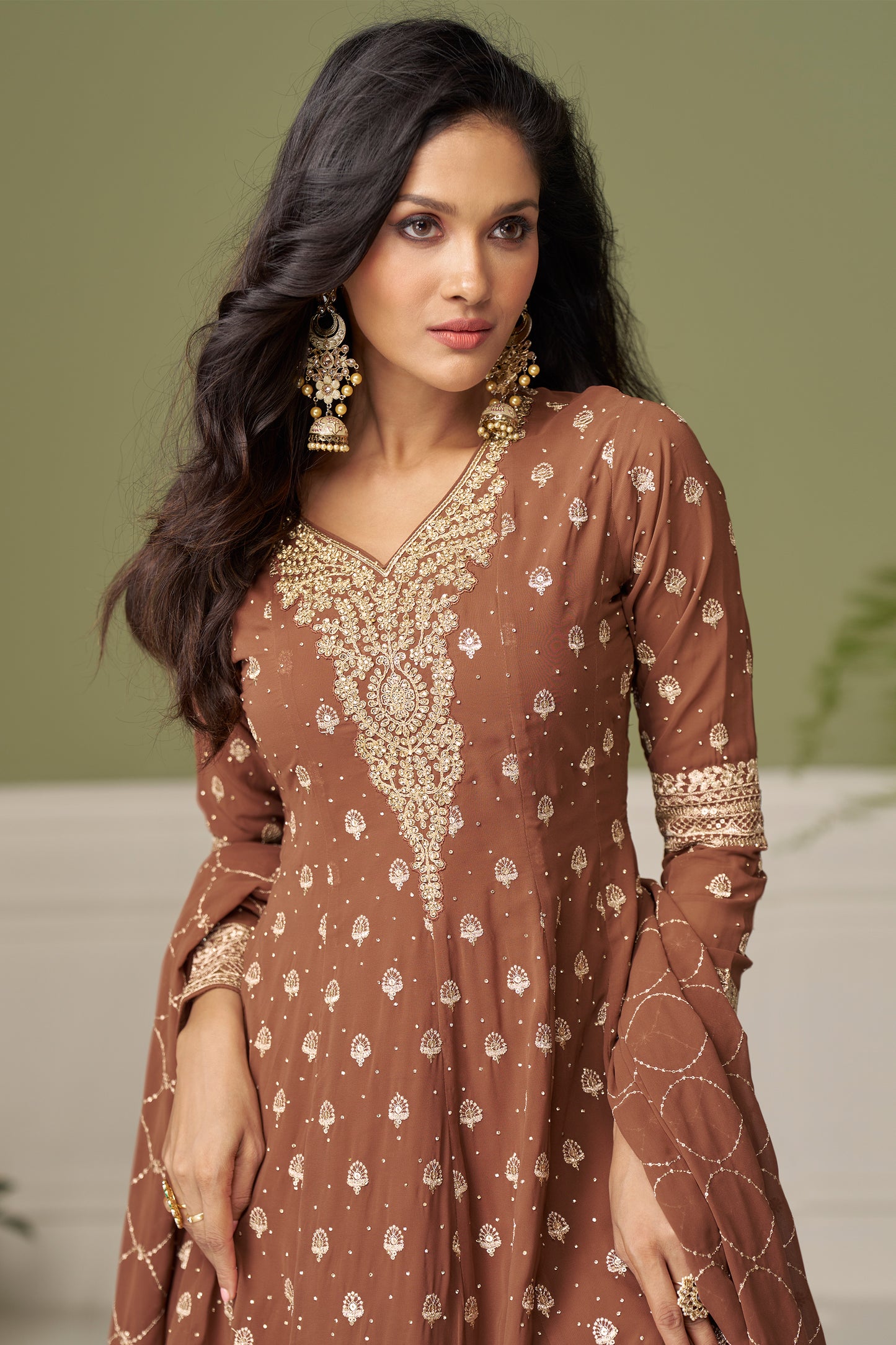 Close-up of embroidery work on bronze georgette fabric