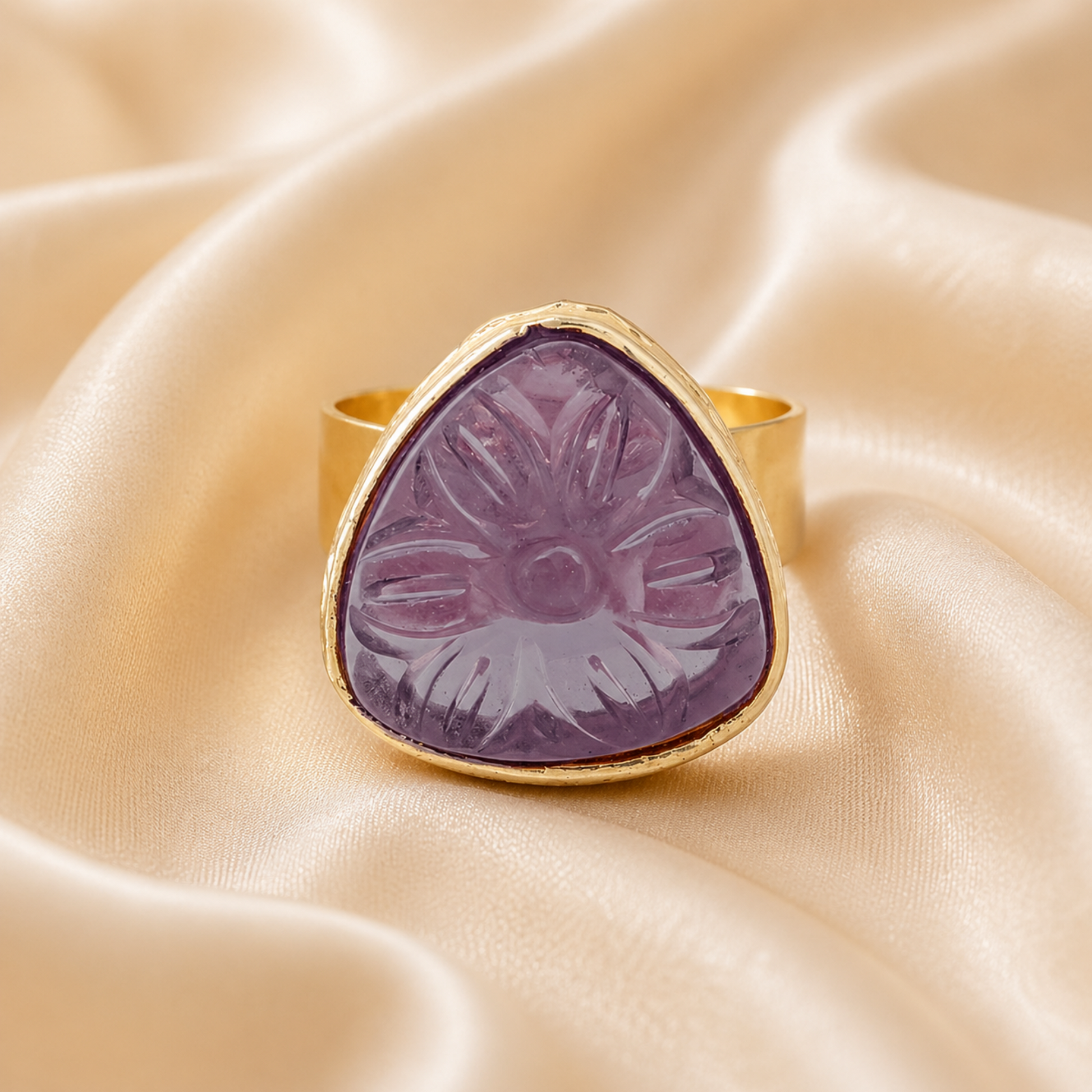 Floral carved stud earrings with reflective teardrop border