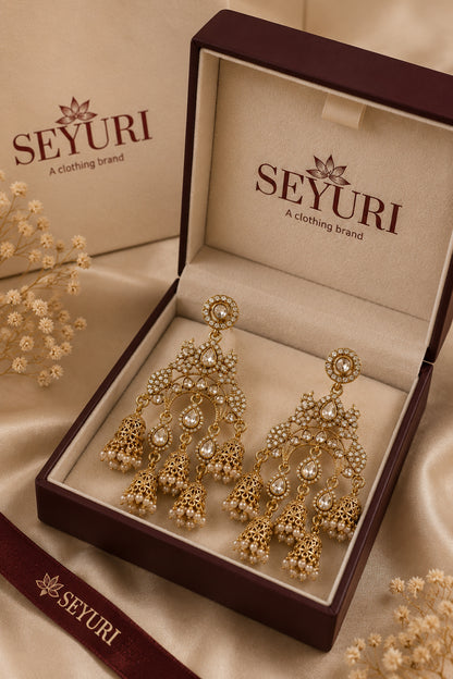 Fashion jewellery earrings with cascading bead accents