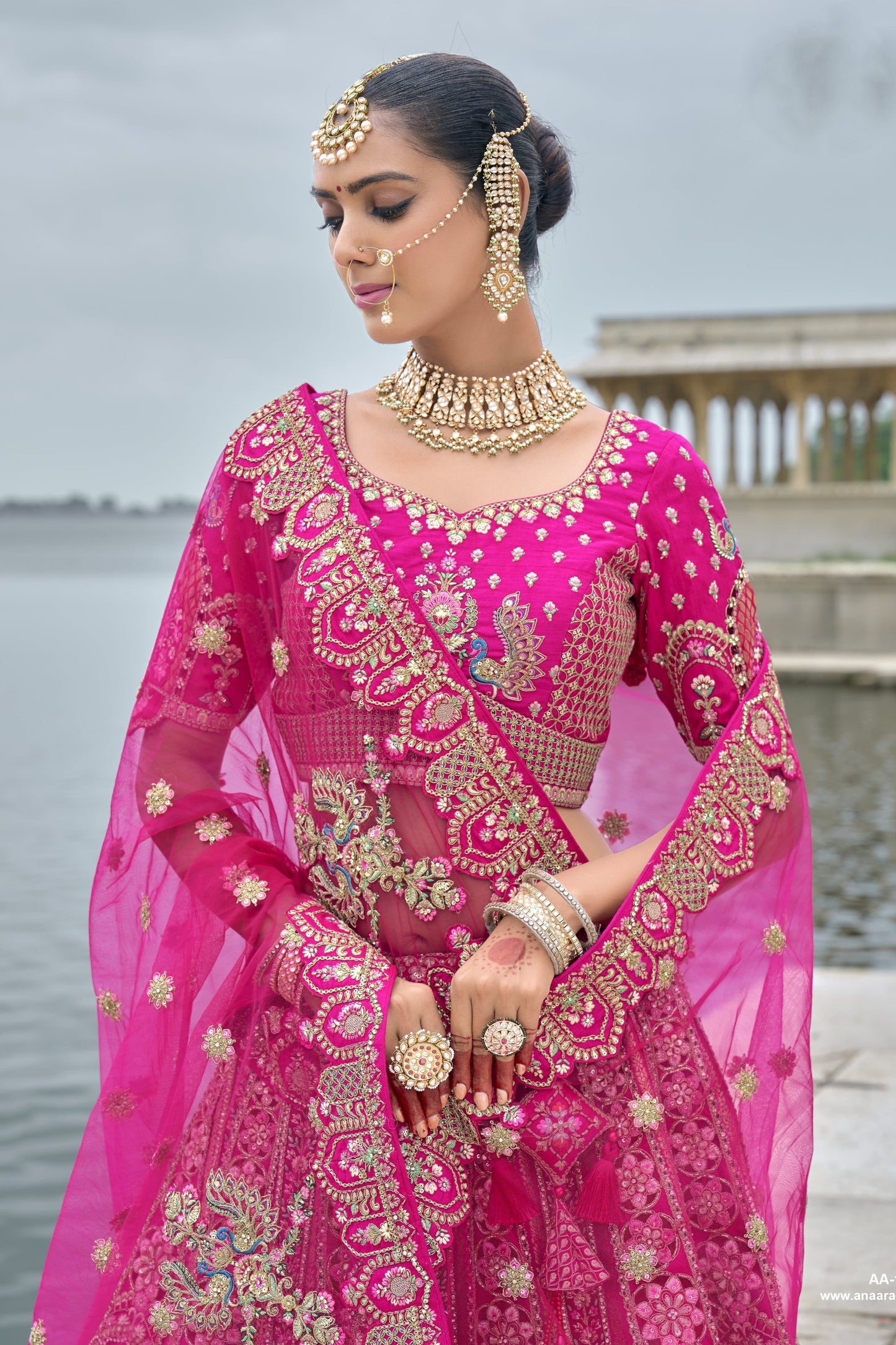 Close-up of sequins and embroidery work on pink lehenga
