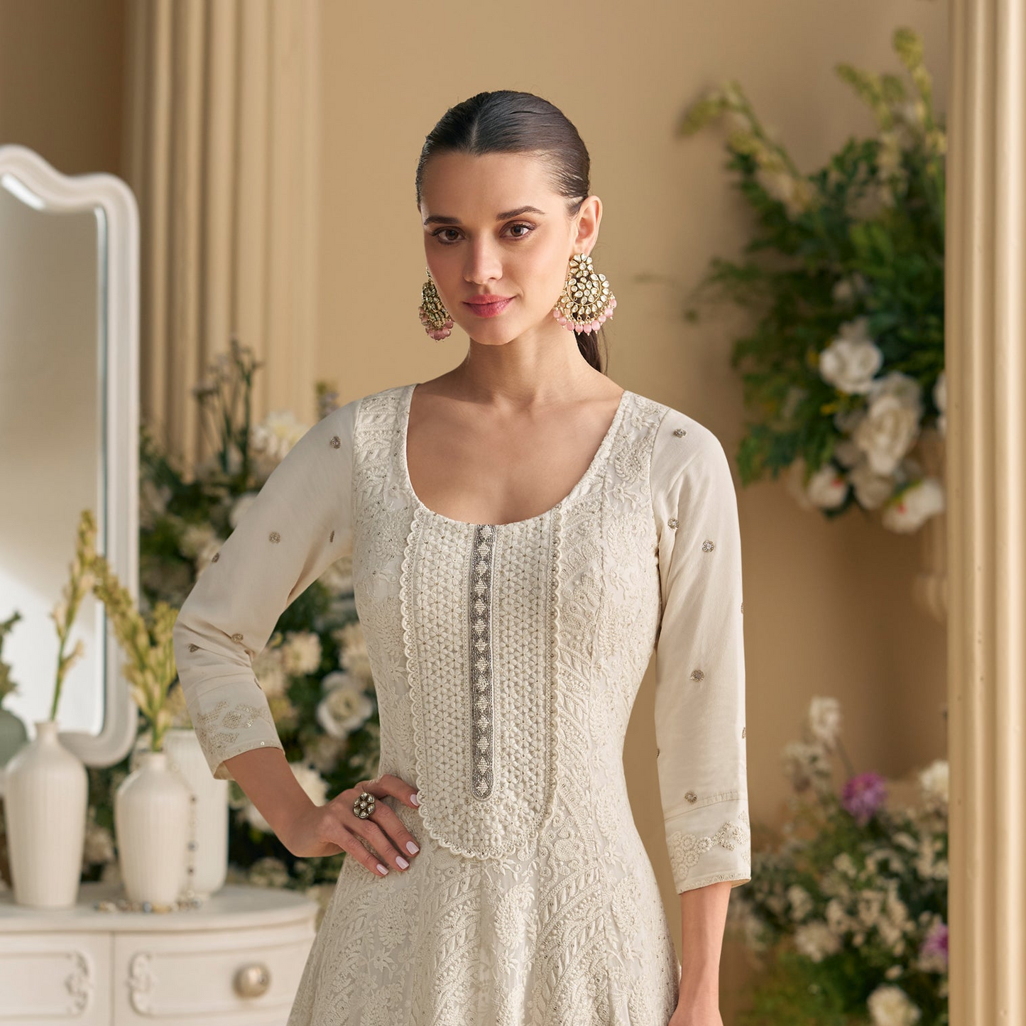 Side view of white anarkali gown with flare