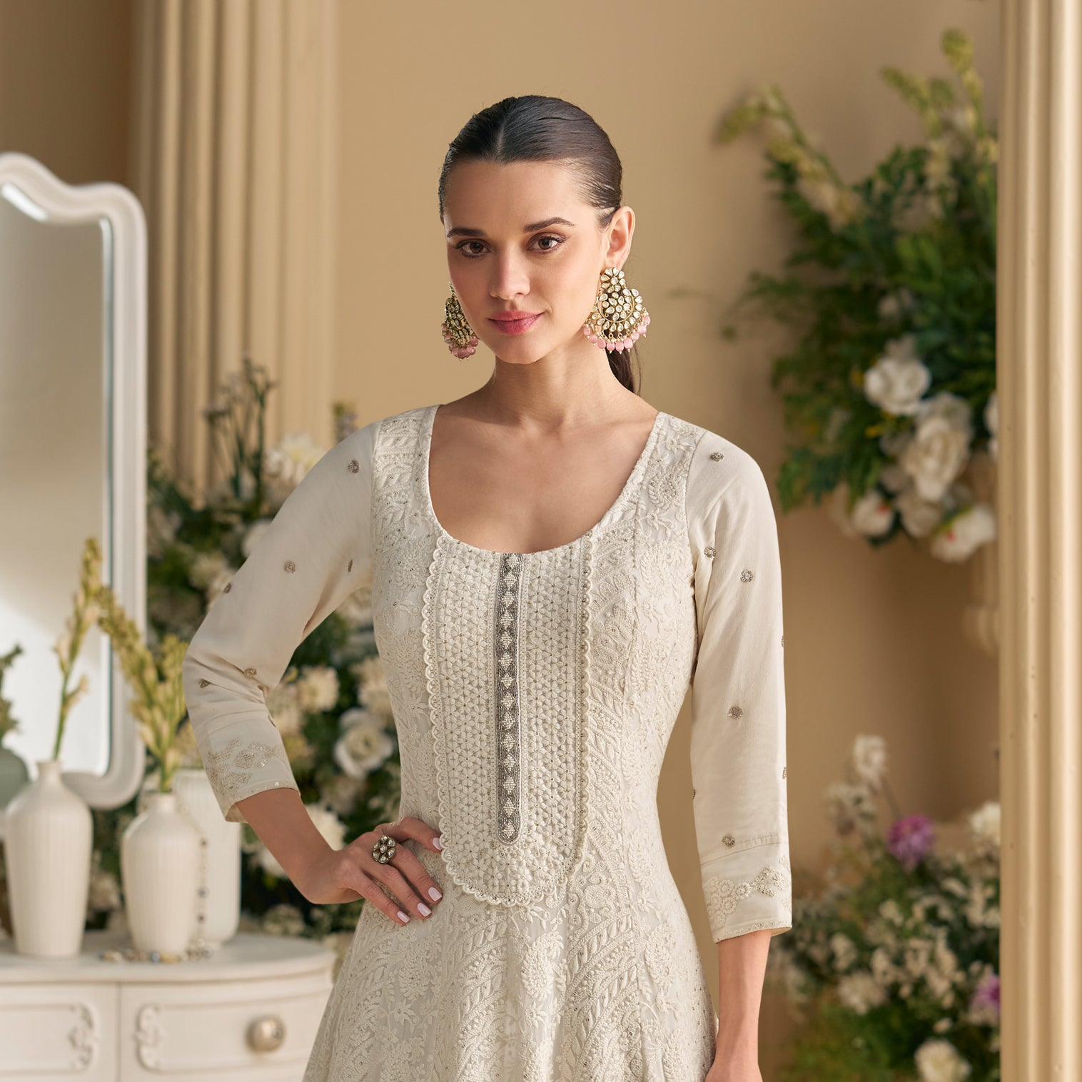 Side view of white anarkali gown with flare