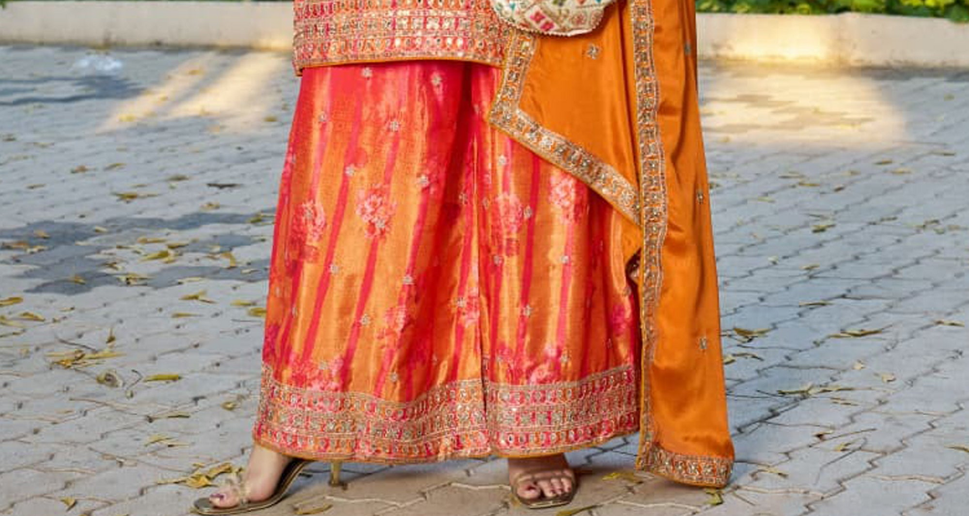 Orange Palazzo Suit paired with traditional accessories