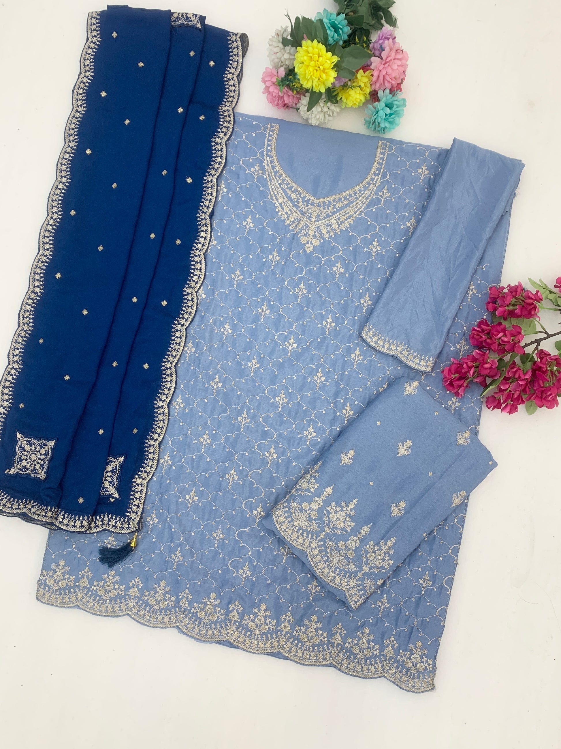 Fabric texture detail of sky blue Chinon palazzo suit