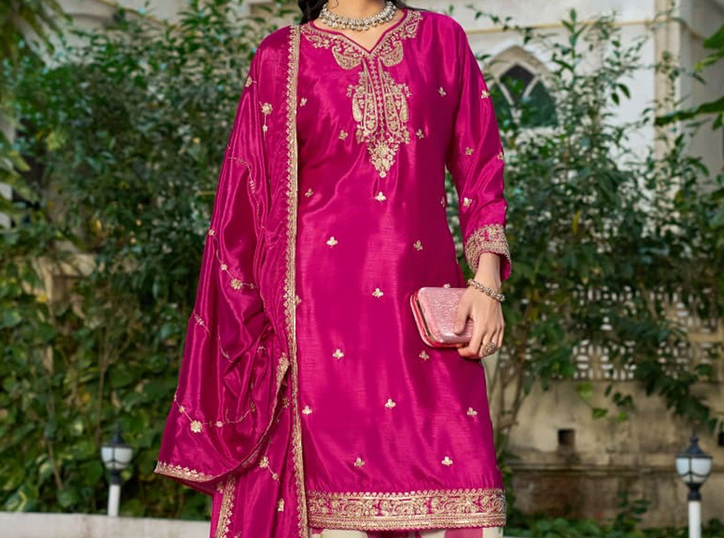 Model wearing Magenta Pink Palazzo Suit with matching dupatta
