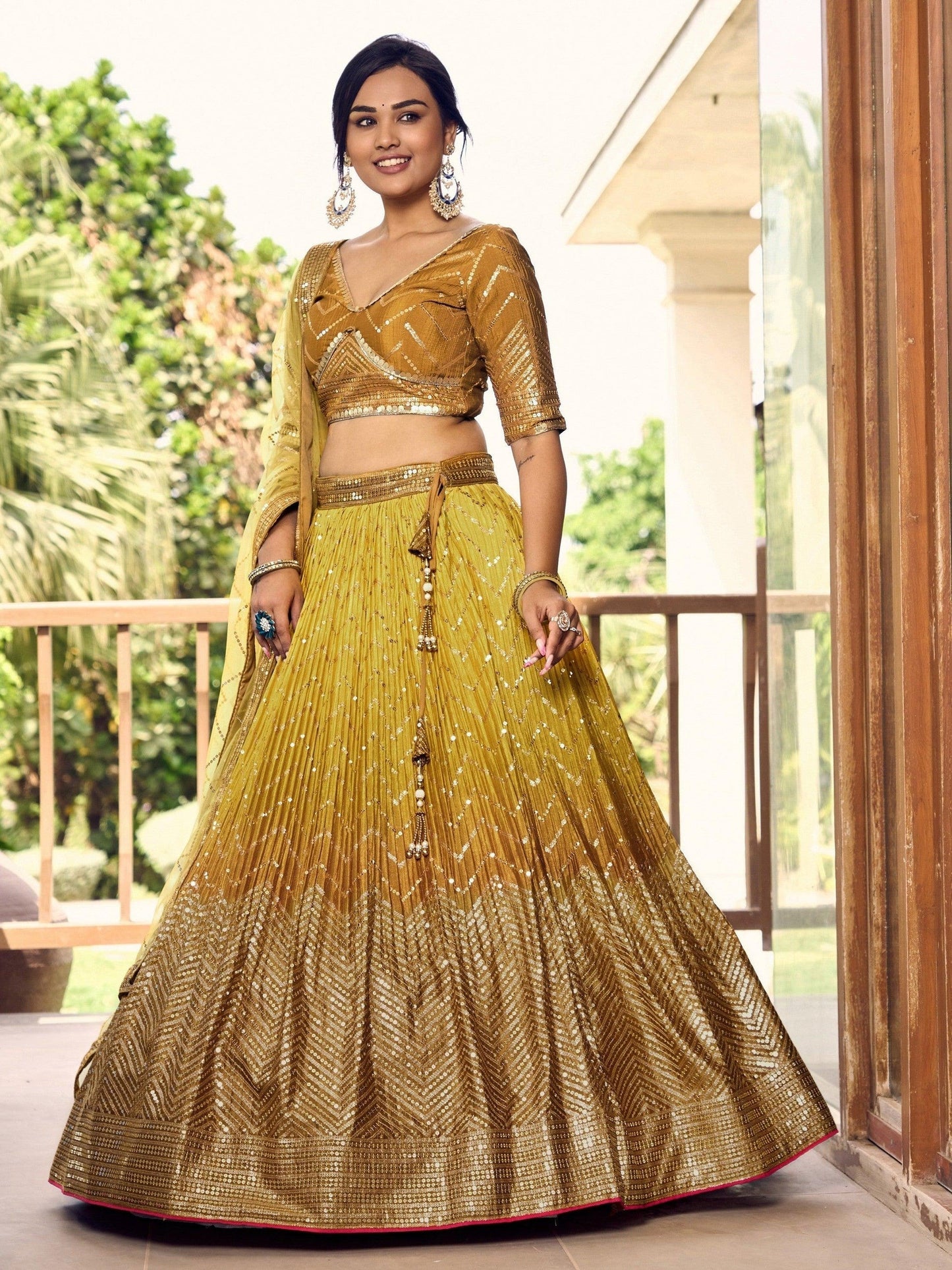 Thread embroidery detail on golden bridal lehenga skirt
