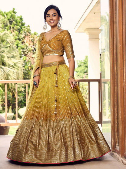 Thread embroidery detail on golden bridal lehenga skirt