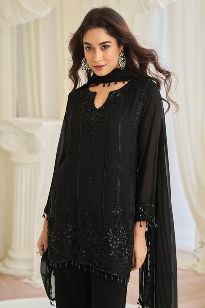 Close-up of bead embroidery on black kameez
