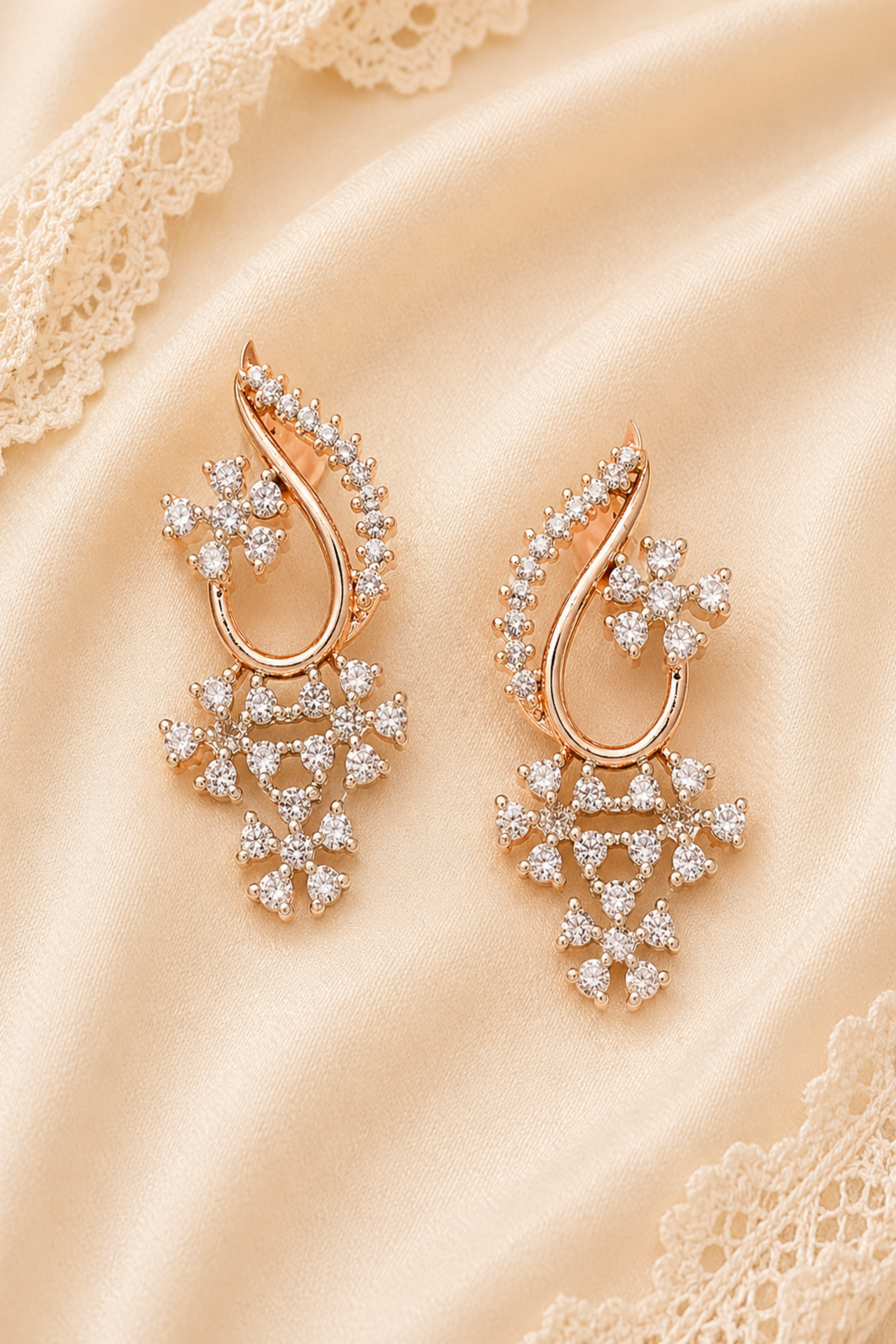 Curved rose gold-tone necklace detail with floral motifs