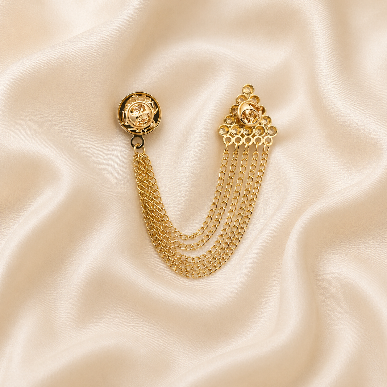 polished metal brooch with multi chain drop design
