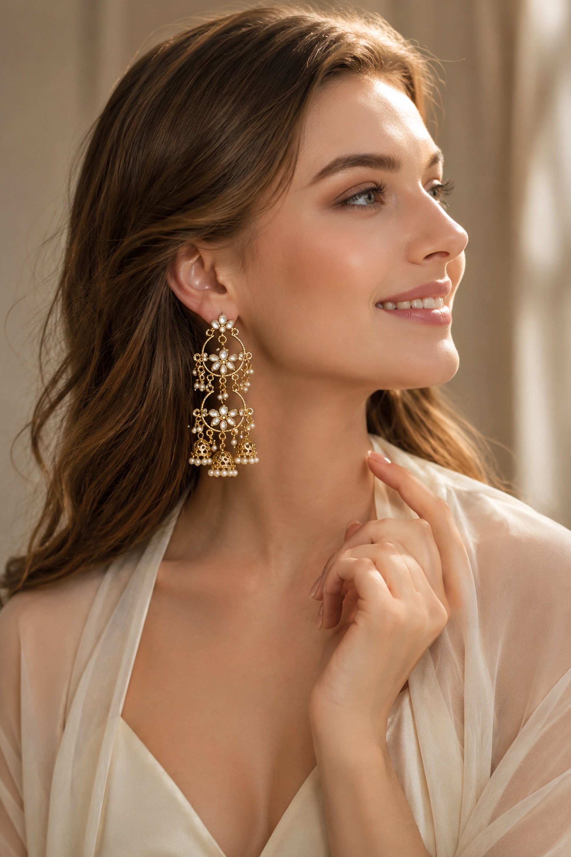 Chandbali earrings displayed on marble styling surface