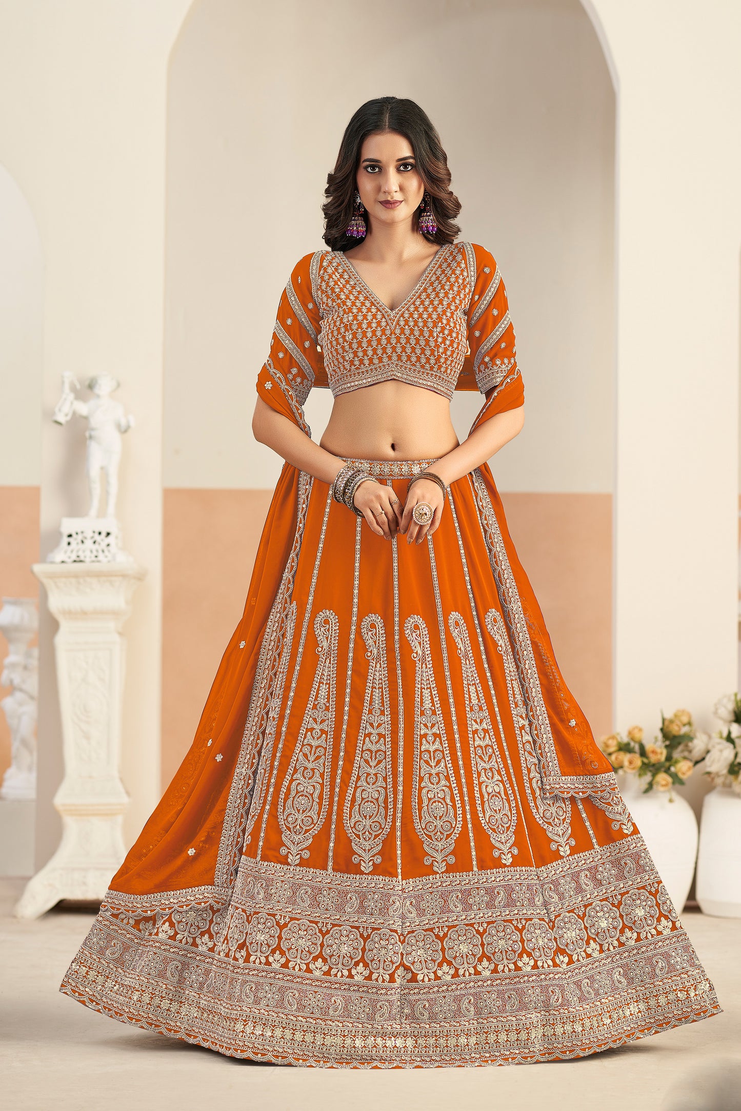 Coral wedding lehenga front view with embroidered blouse