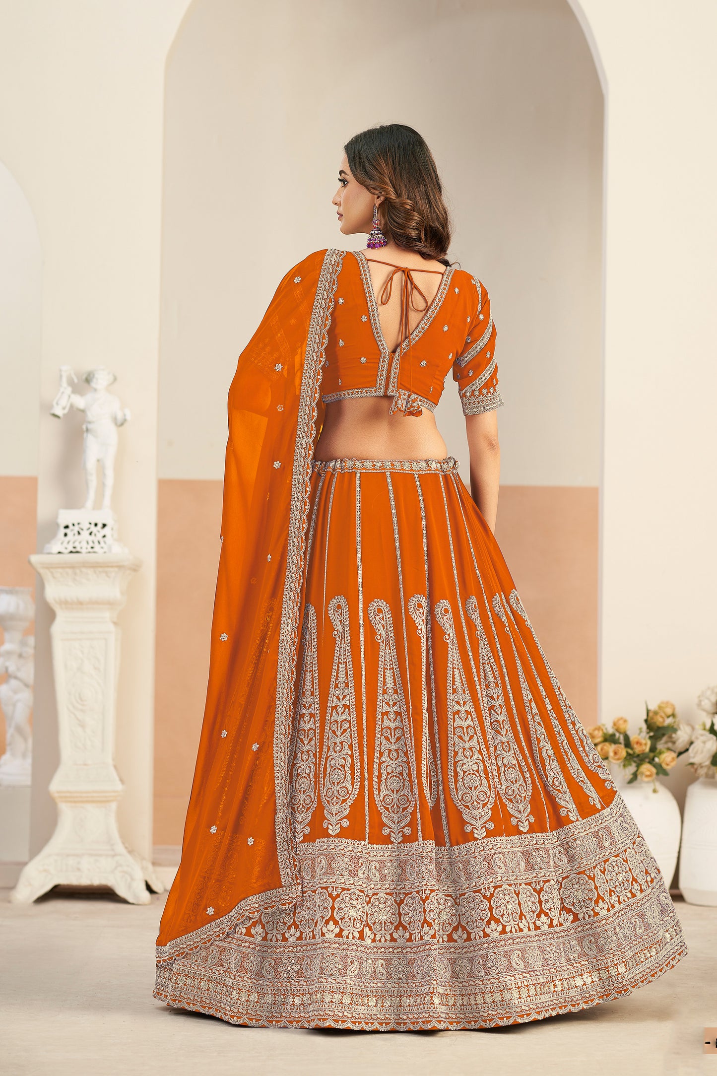 Coral lehenga styled for wedding occasion