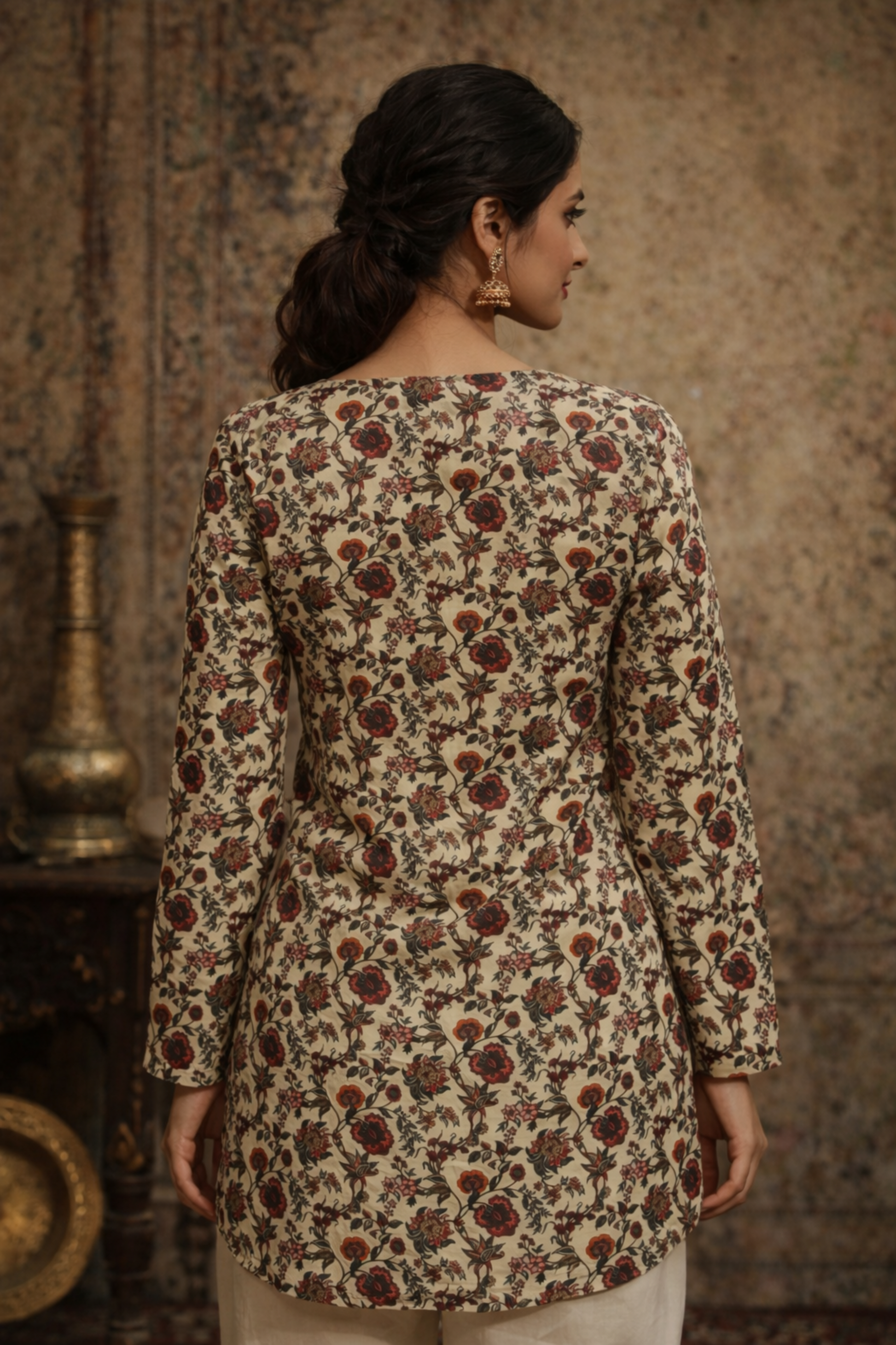 Back profile of cream top showing smooth drape