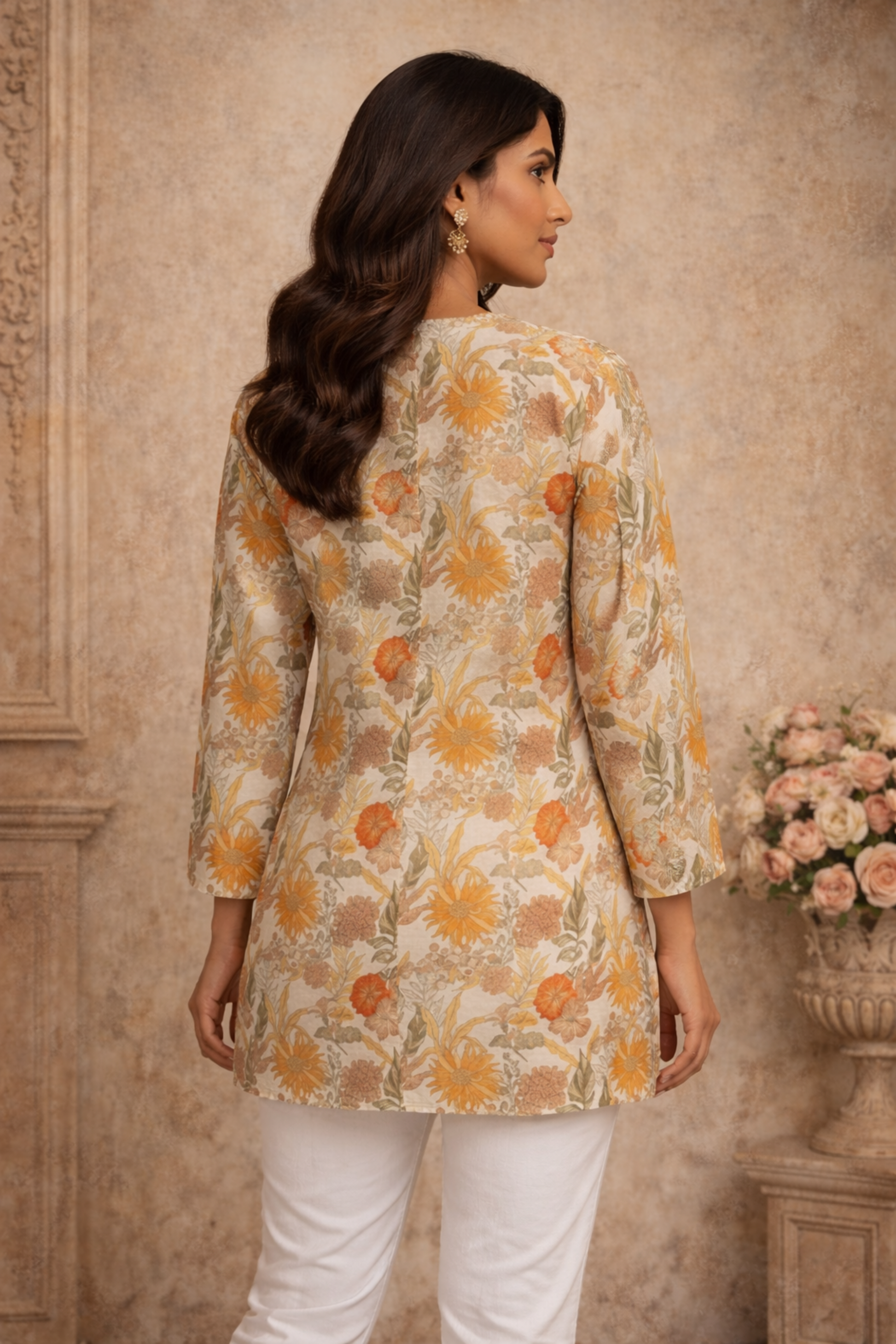 Back view of cream tunic with clean silhouette