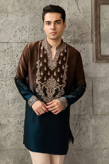 Close-up of thread embroidery on the brown kurta