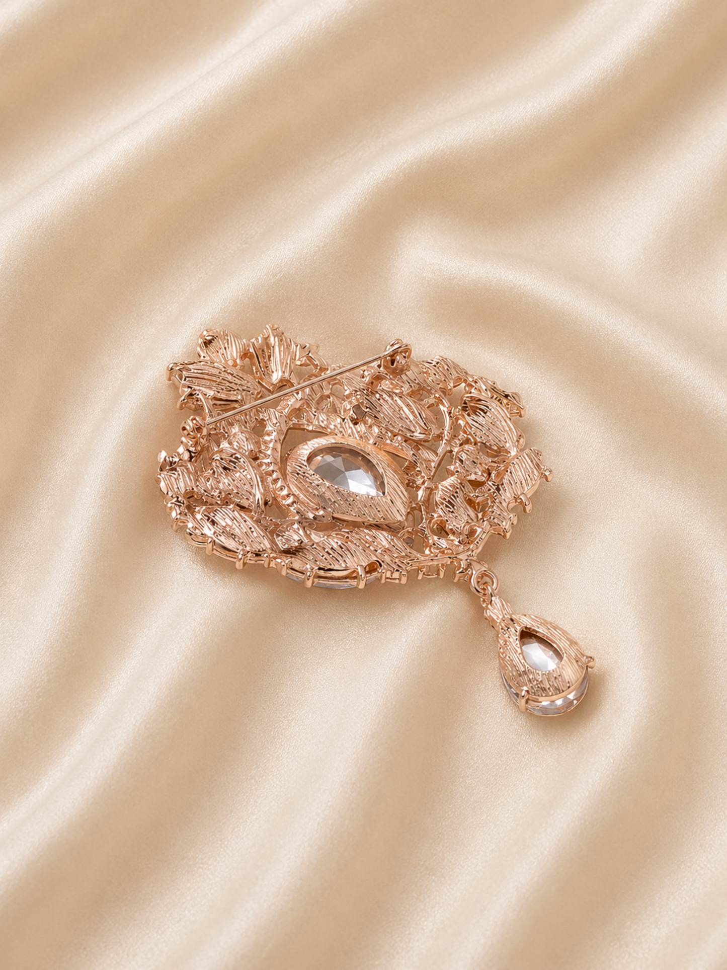 statement brooch with hanging drop element