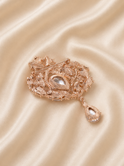 statement brooch with hanging drop element