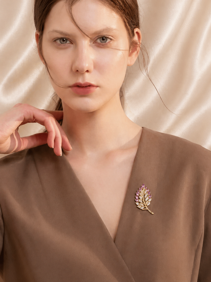 close up of crystal leaf brooch with marquise shapes