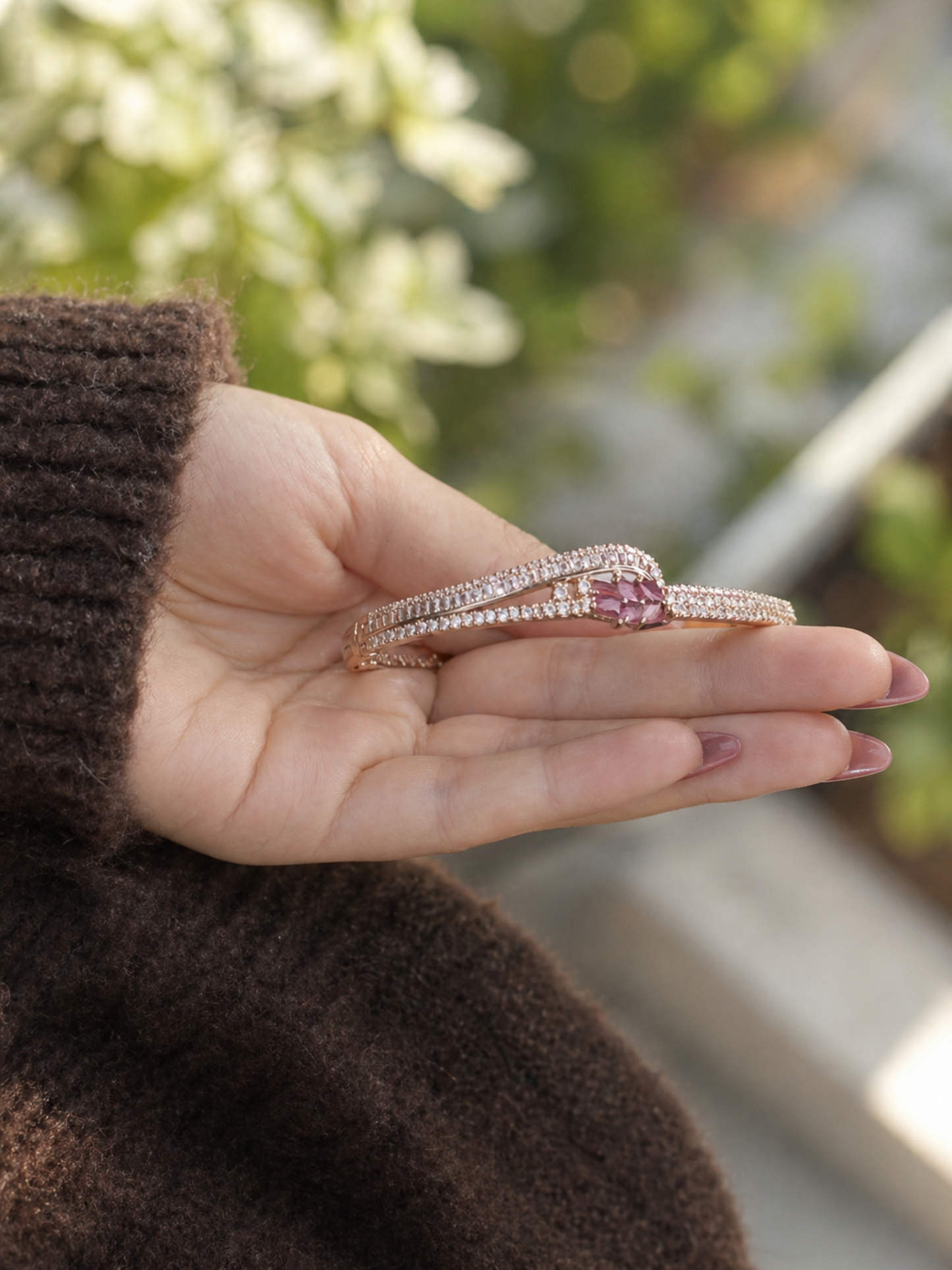 delicate bracelet with pink stones and metal band