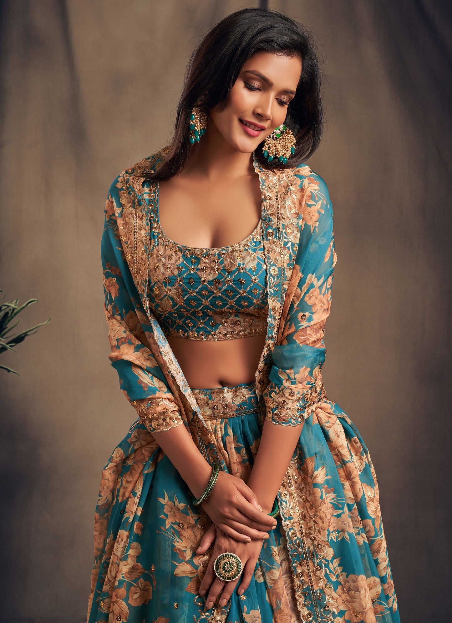 Close-up of organza lehenga fabric with sequence work detail
