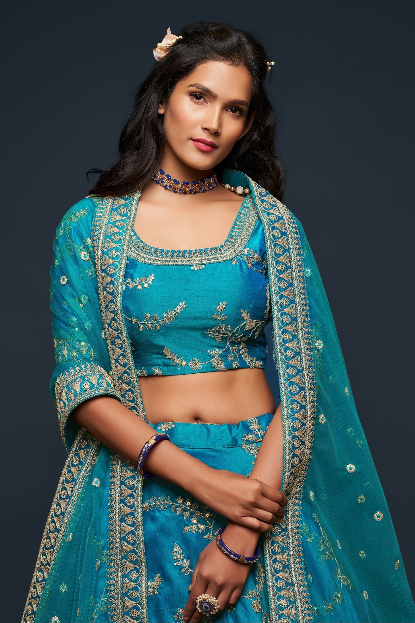 Close-up of zari work on cyan art silk lehenga skirt