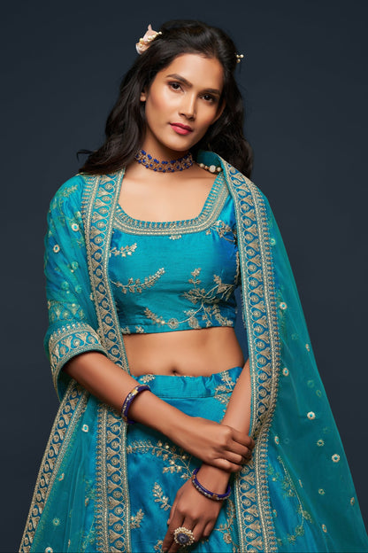 Close-up of zari work on cyan art silk lehenga skirt