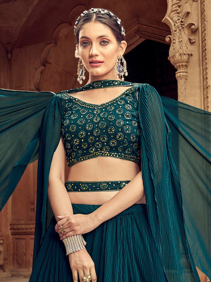 Close-up of thread embroidery on dark blue choli