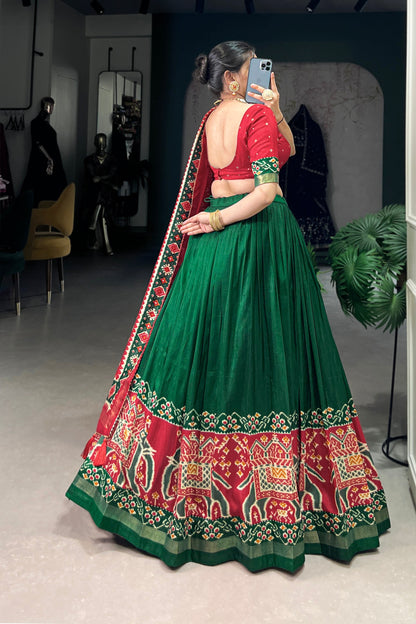 green lehenga choli back view with tassel detail
