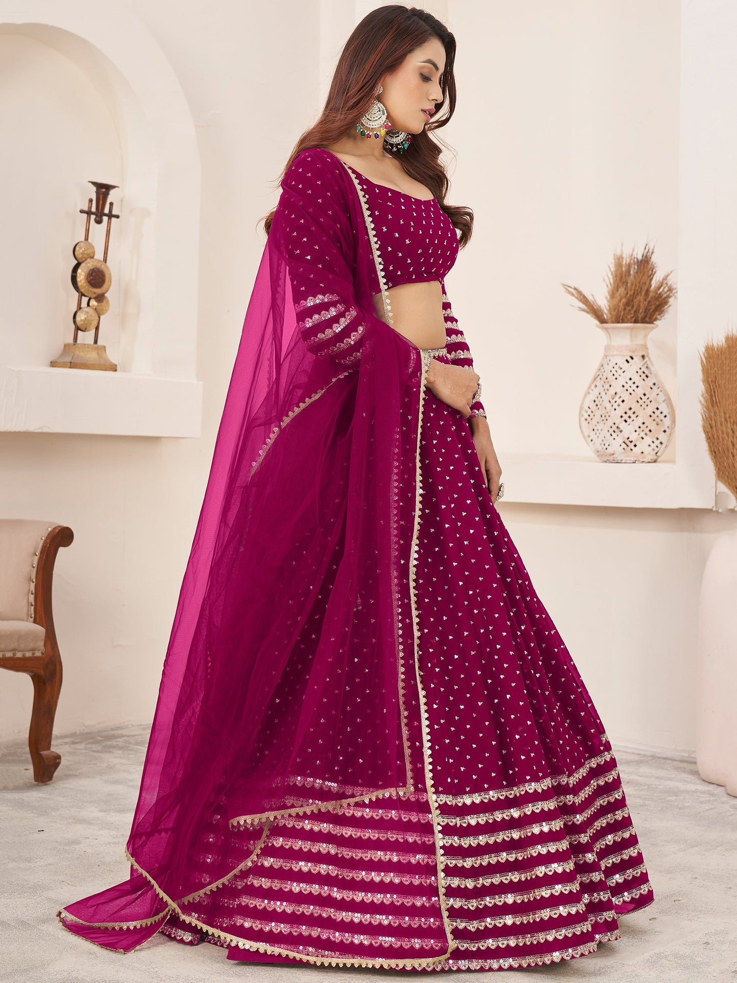 Thread embroidery detail on dark pink indianlehenga choli