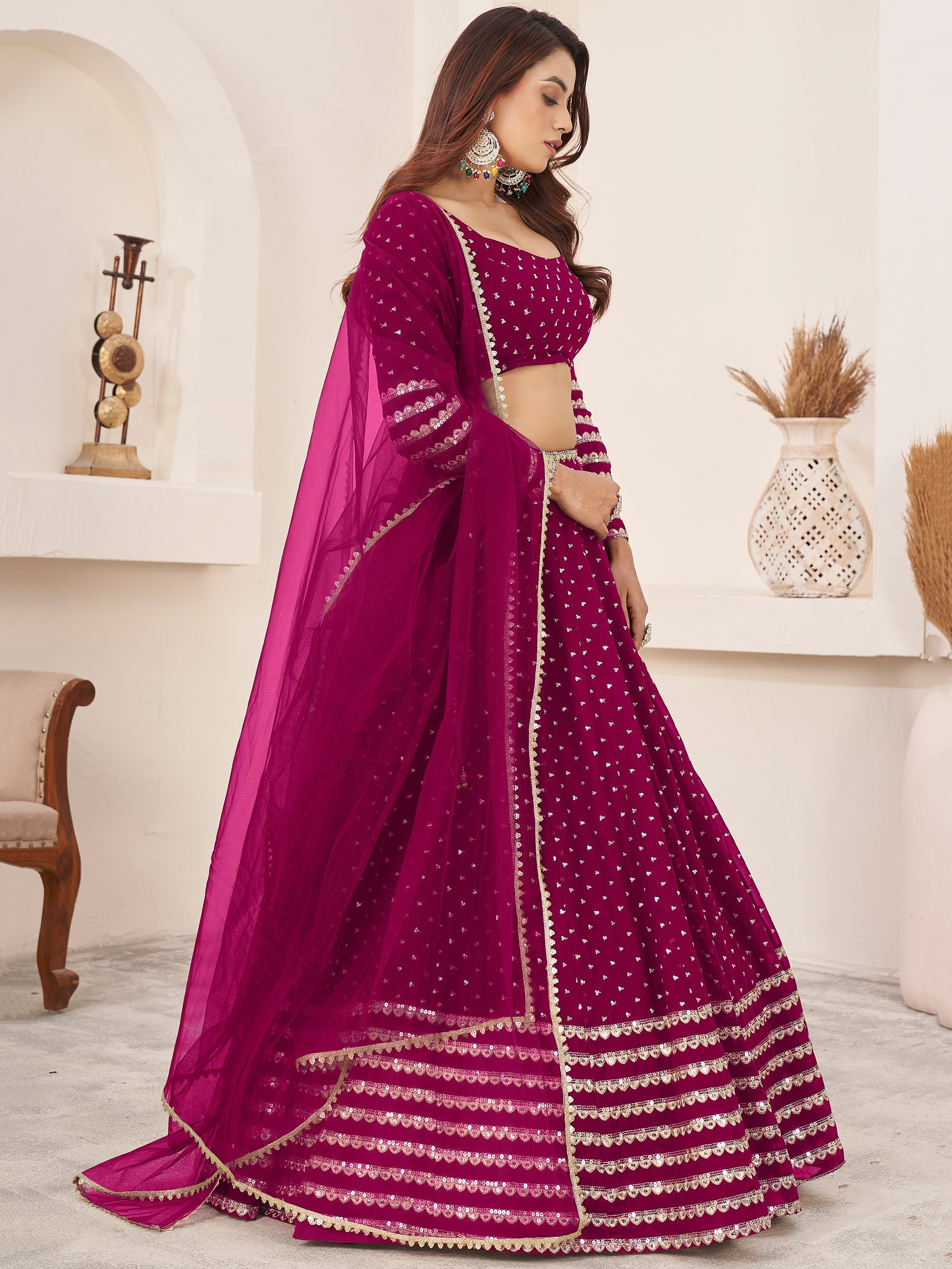 Thread embroidery detail on dark pink indianlehenga choli