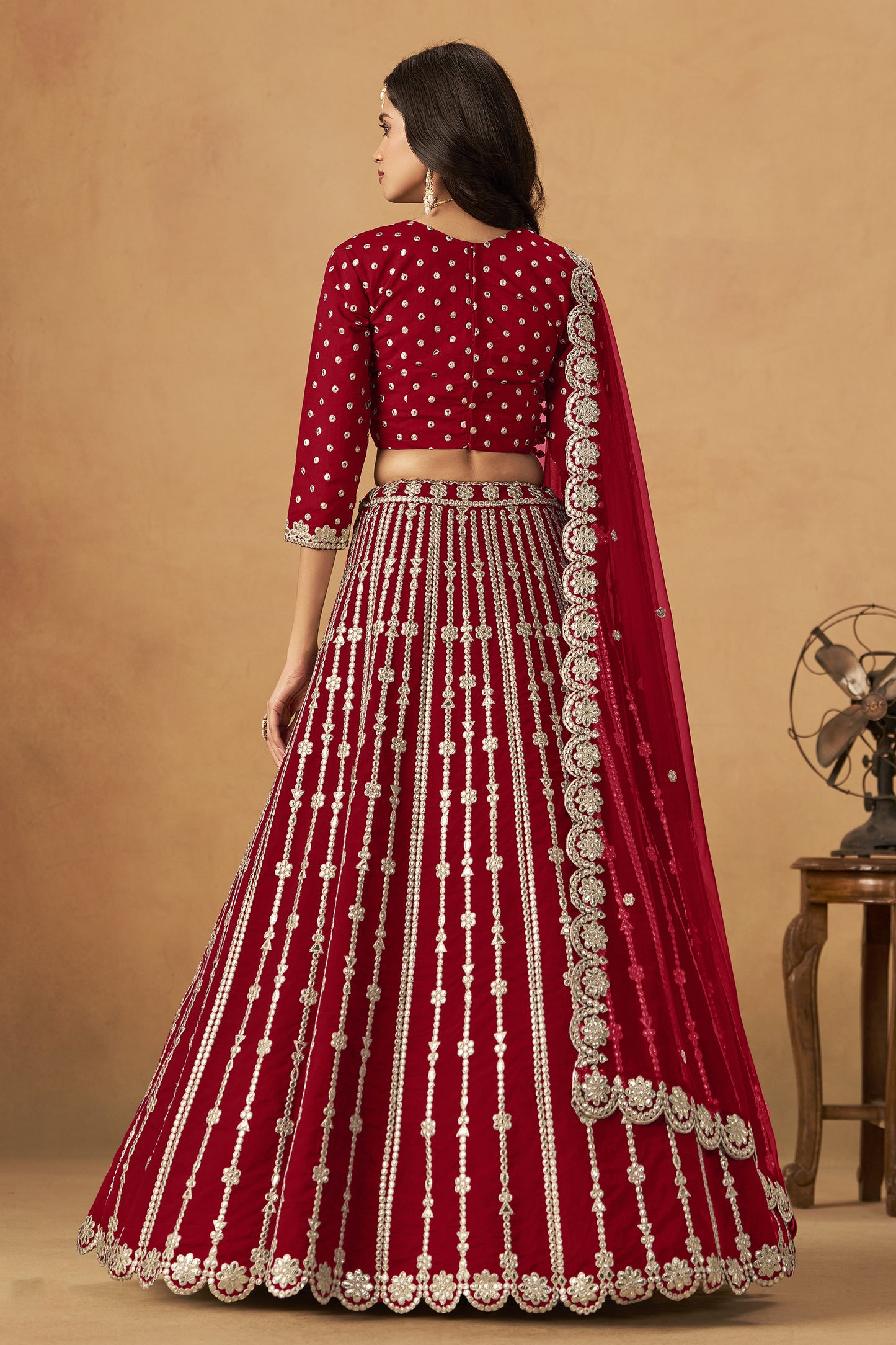 Back view of dark red lehenga choli with dupatta drape