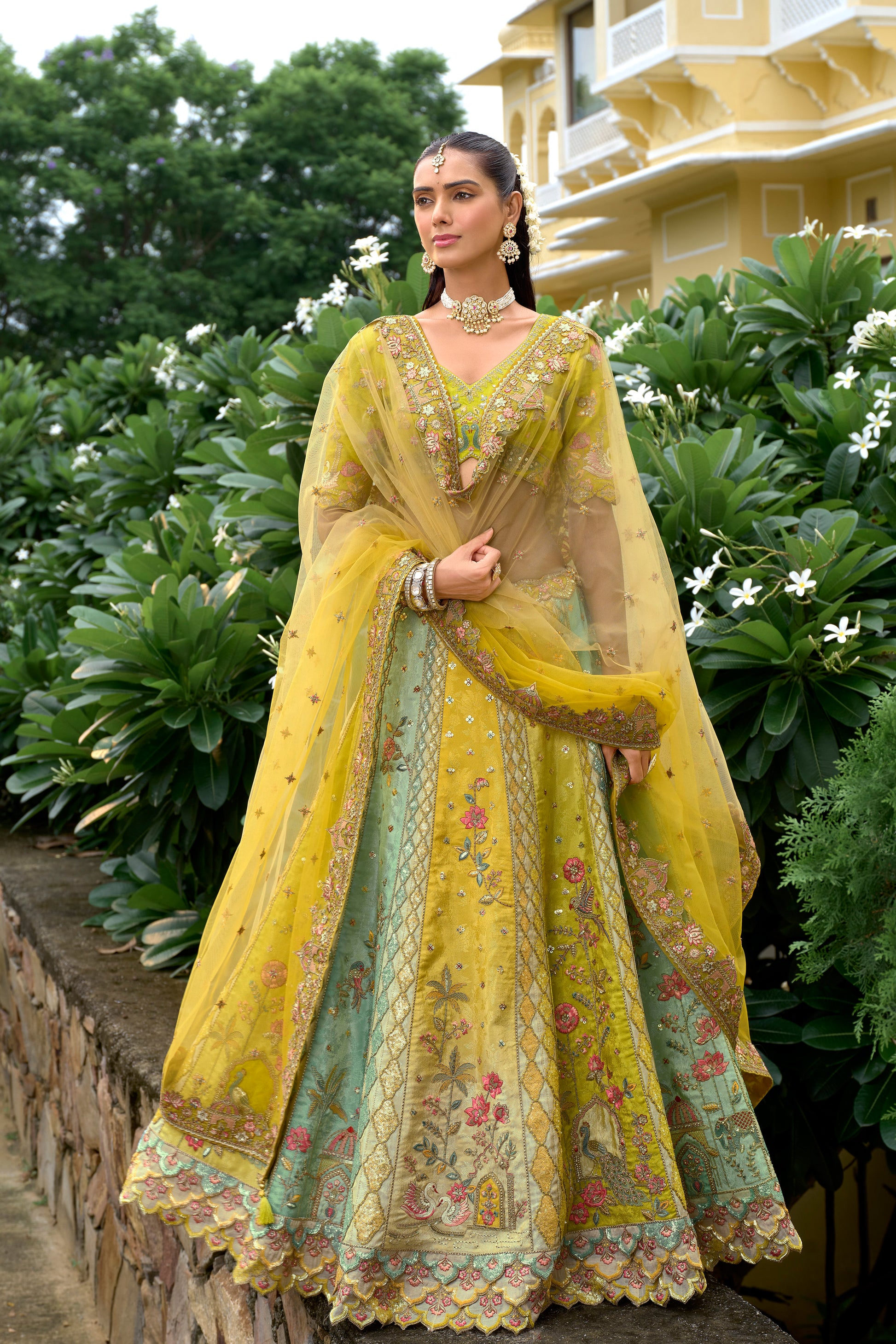 Yellow lehenga front view with silk texture and embroidery