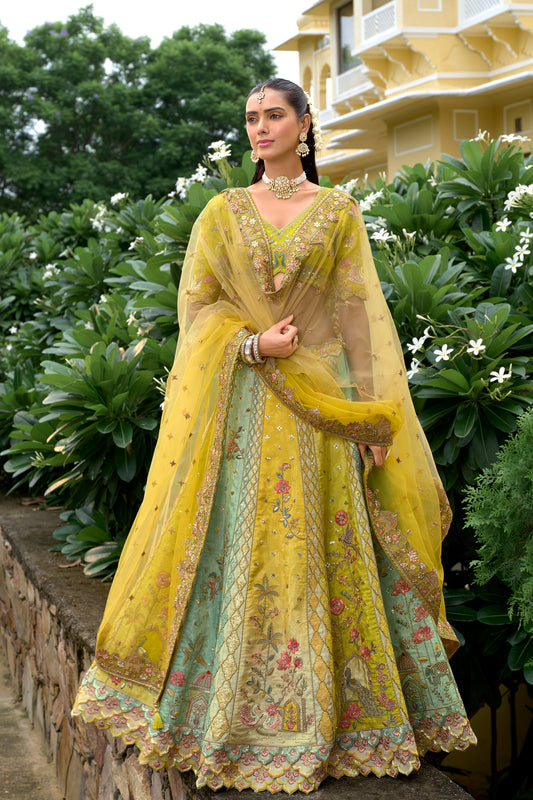 Yellow lehenga front view with silk texture and embroidery