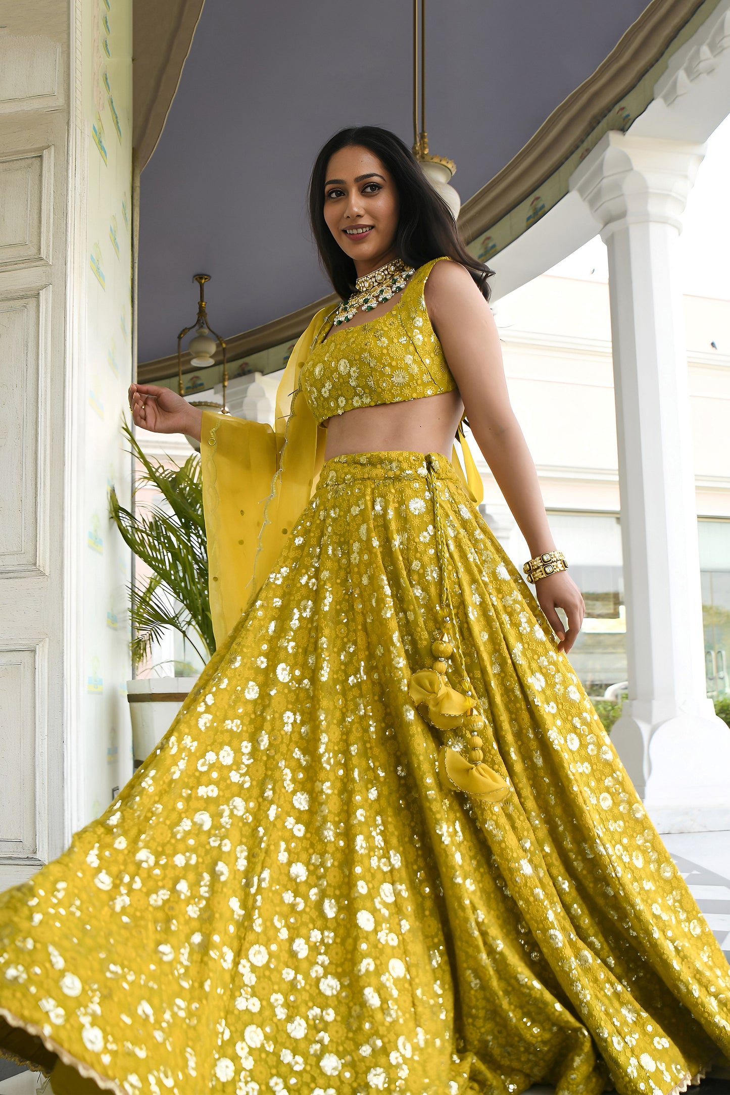 Side profile of sequins embroidered lehenga choli