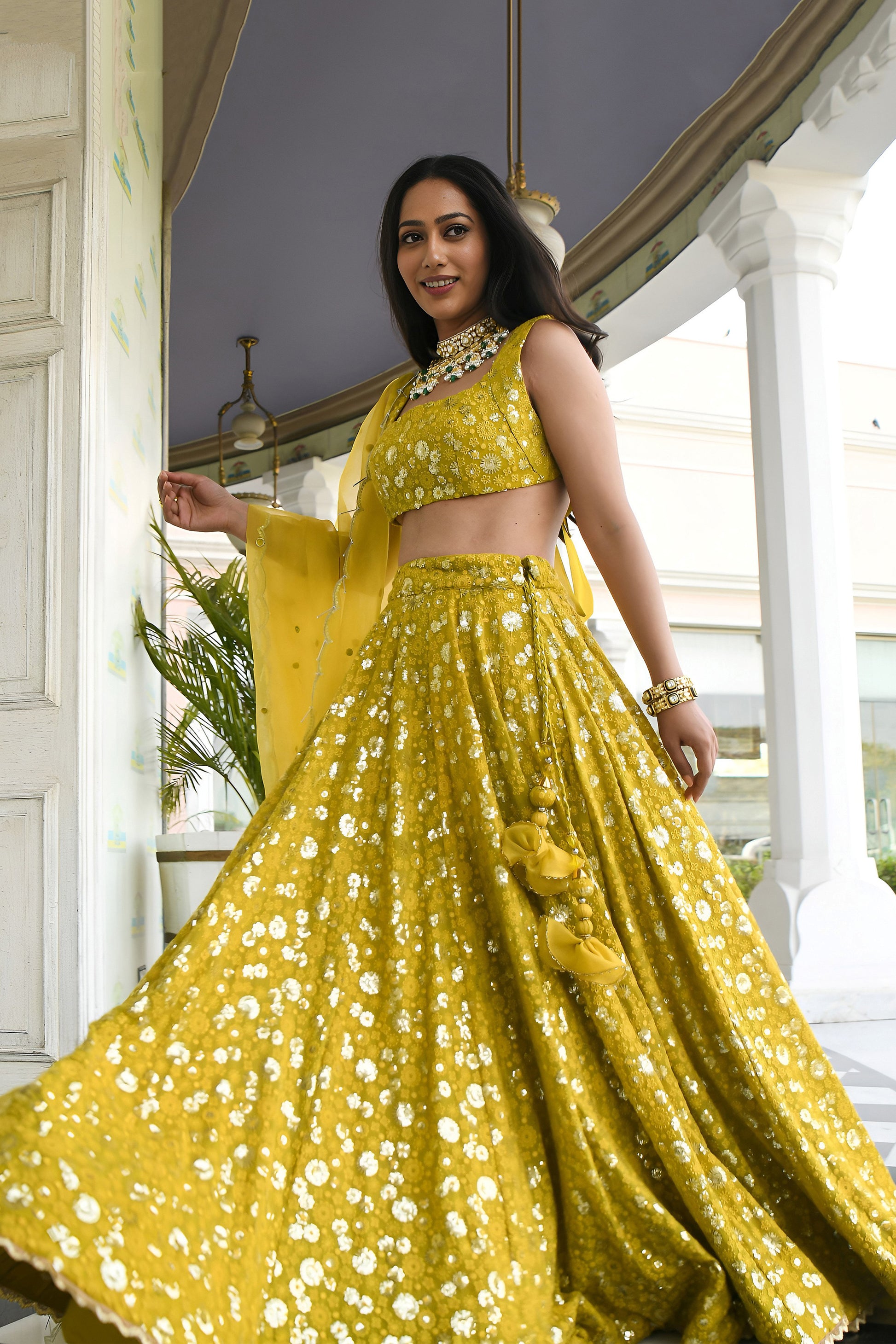 Side profile of sequins embroidered lehenga choli