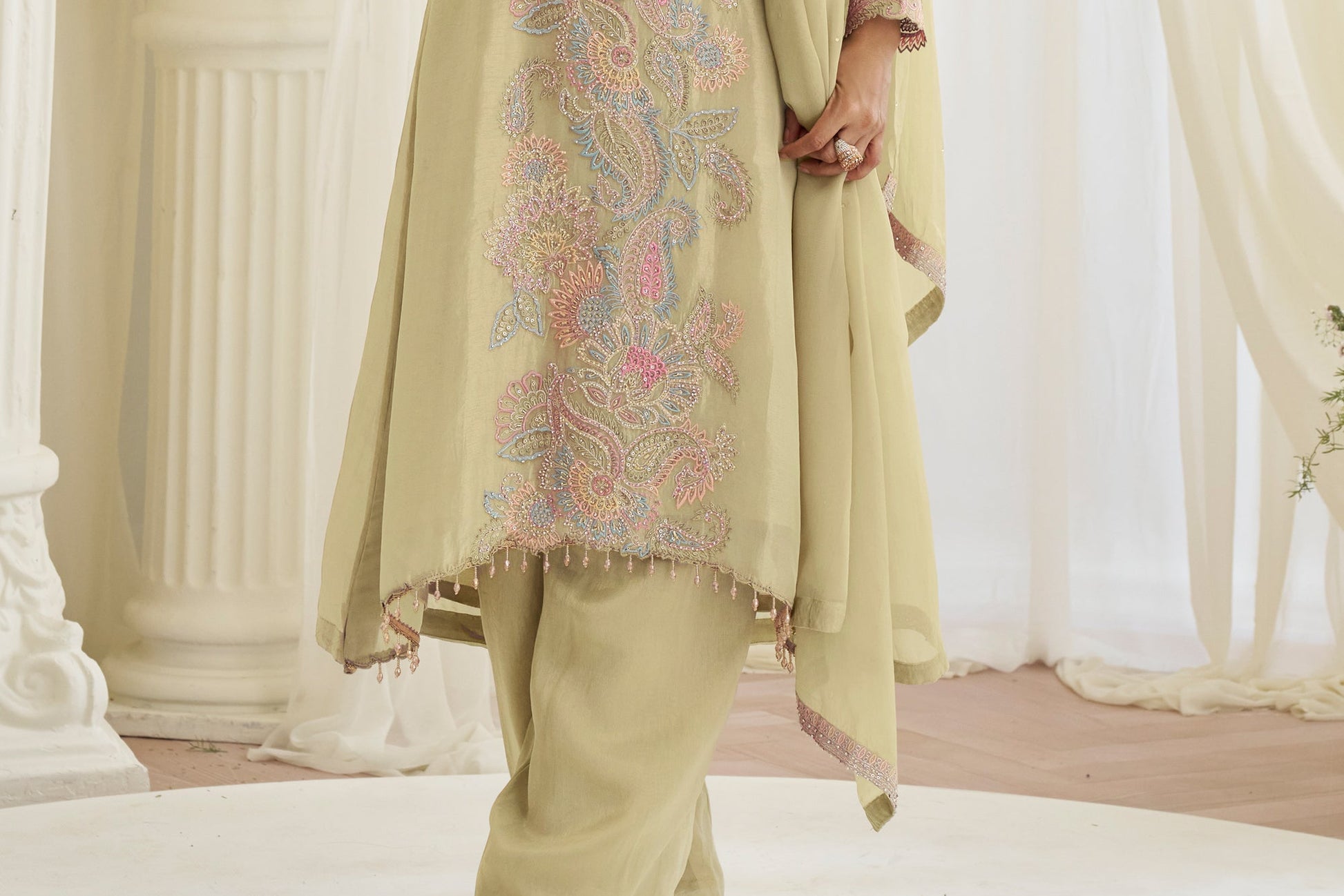 Hem detail of dark yellow sharara pants