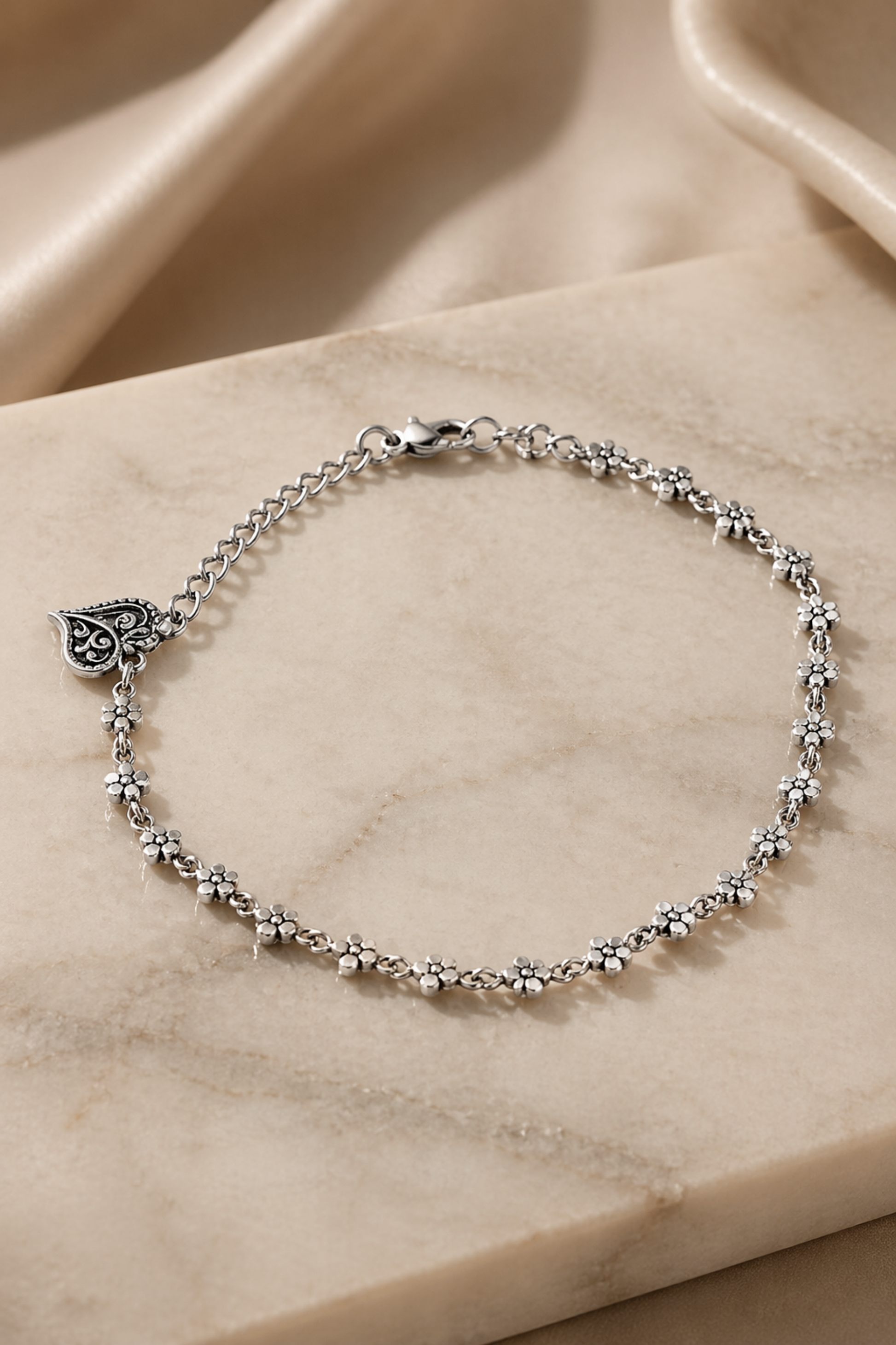 delicate metal anklet with small floral links