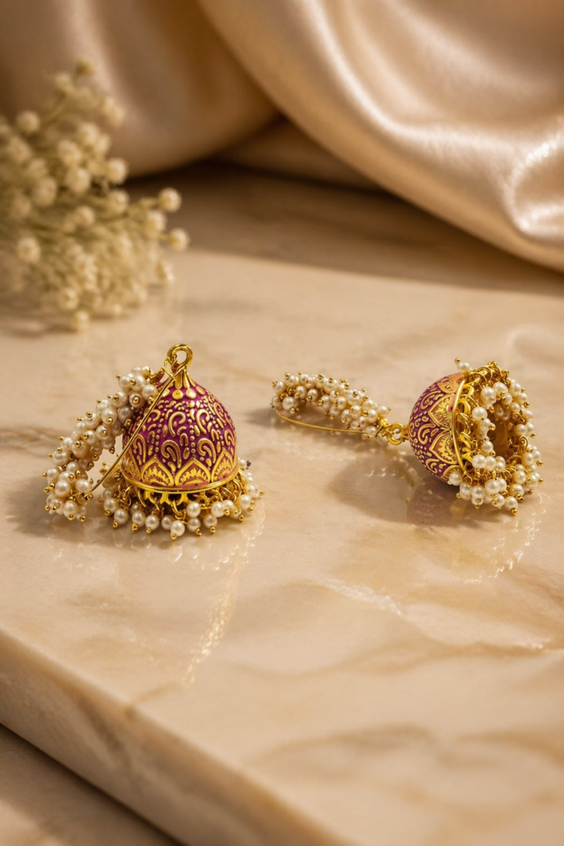 traditional pink dome jhumka earrings close up
