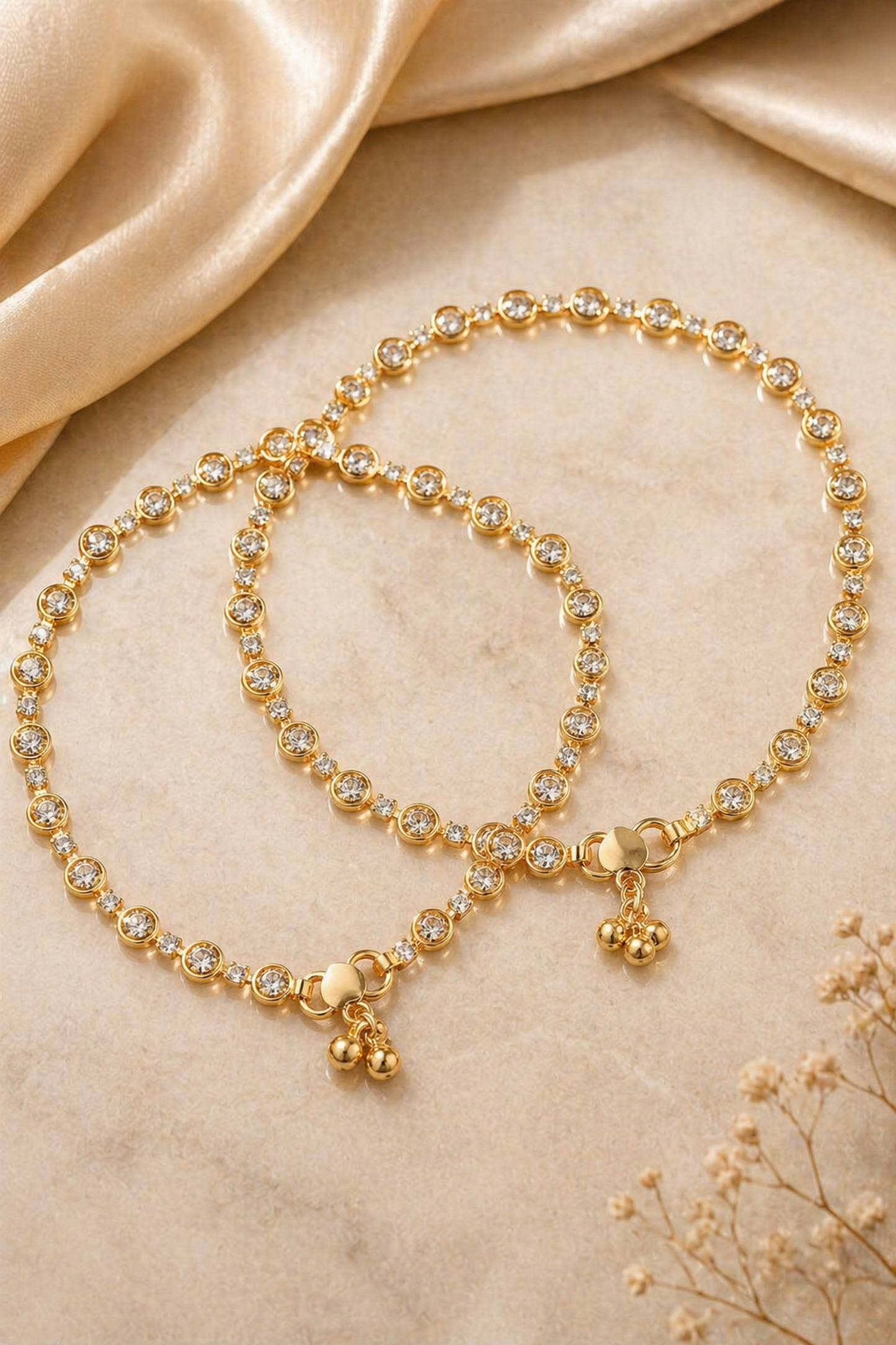 gold anklet with small stones on ankle
