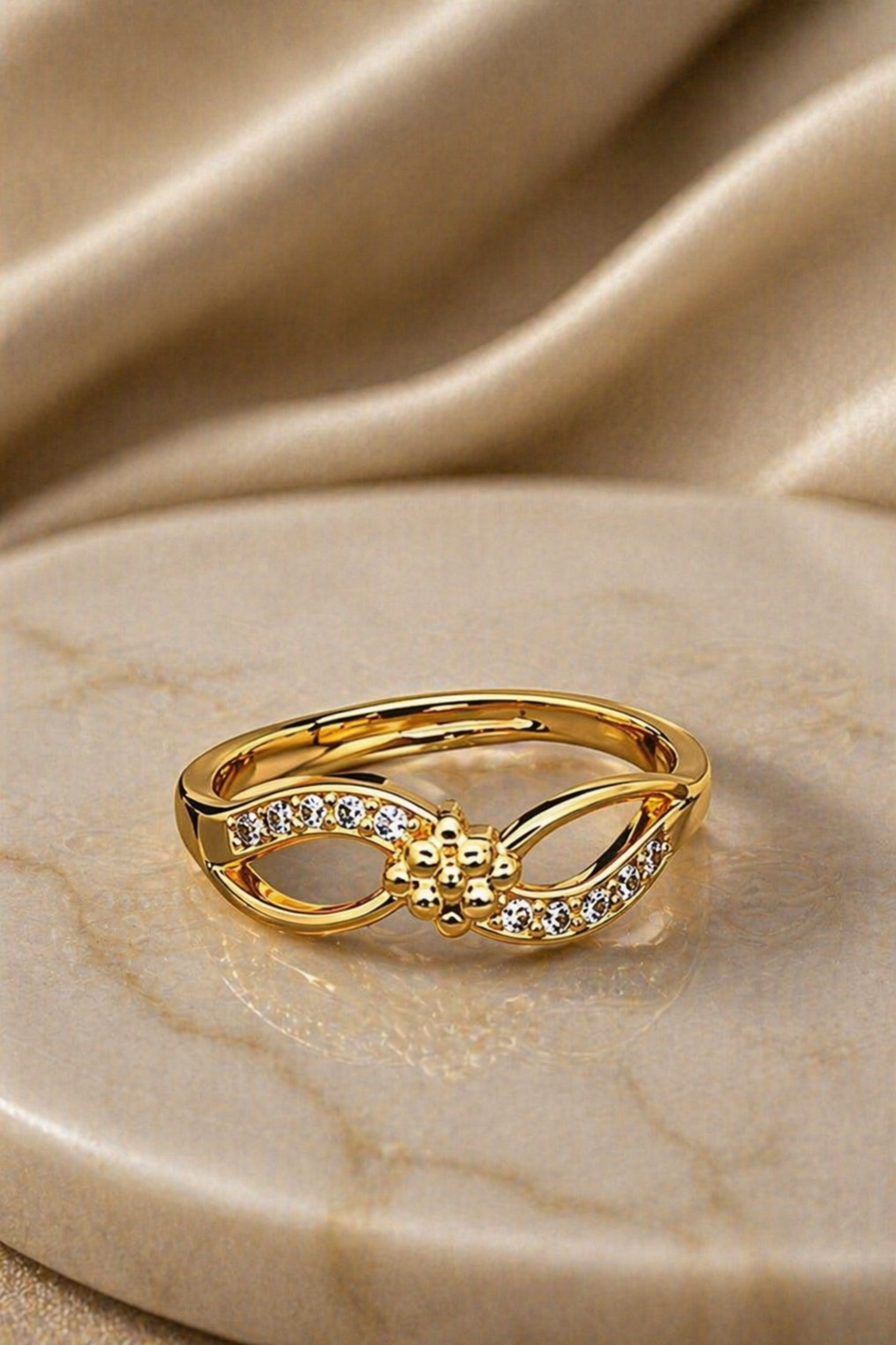 adjustable gold ring with heart detail
