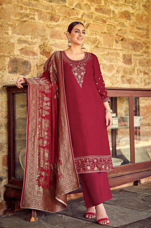 Maroon salwar kameez for summer weddings, close-up on embroidery work.