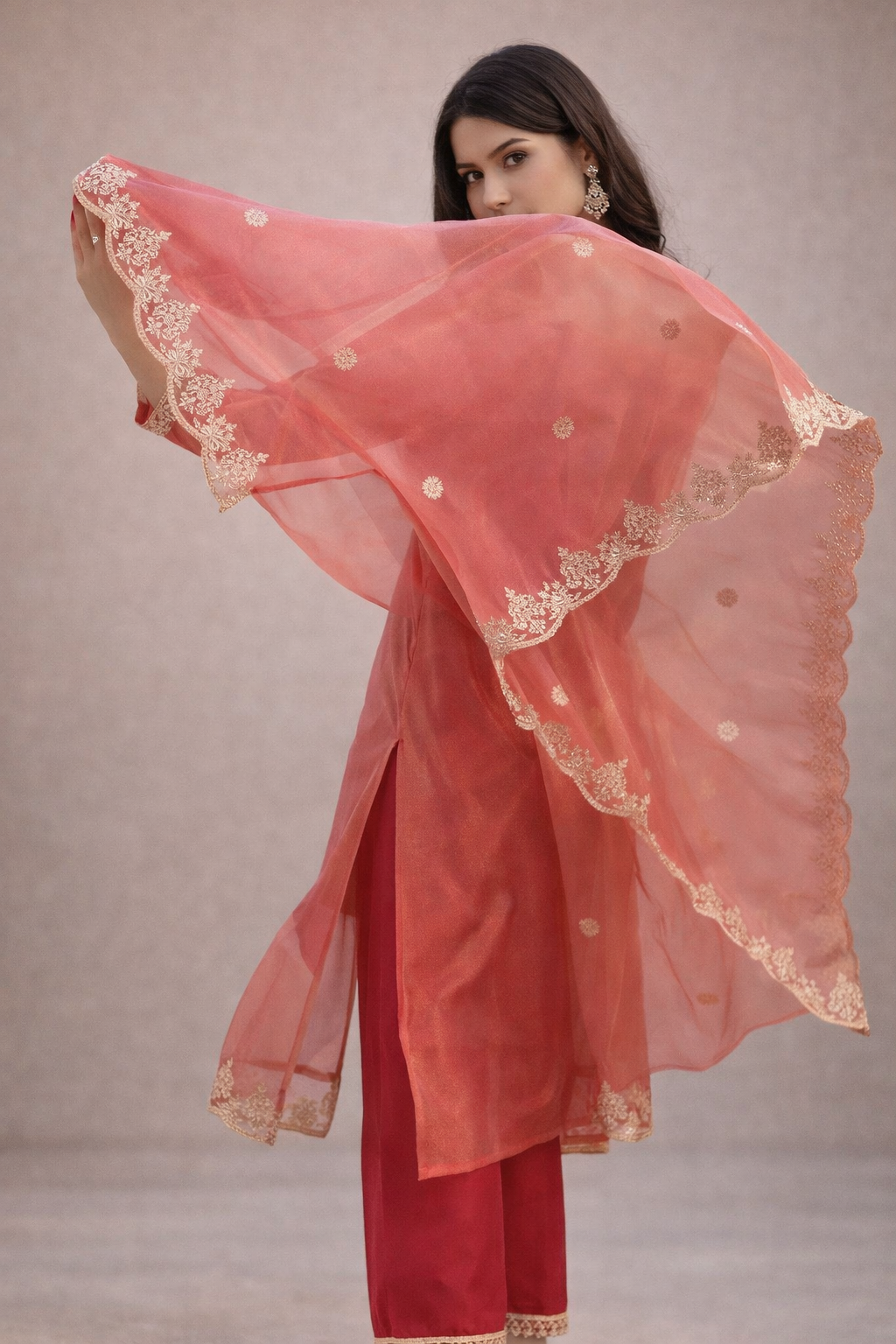 side angle of orange kurti showing soft fabric drape