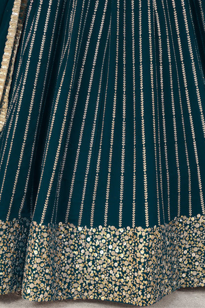 Back design of teal blue choli with embroidery detail