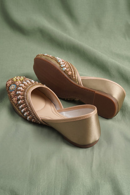 Detailed view of heavy bead and sequin embroidery on ethnic shoes
