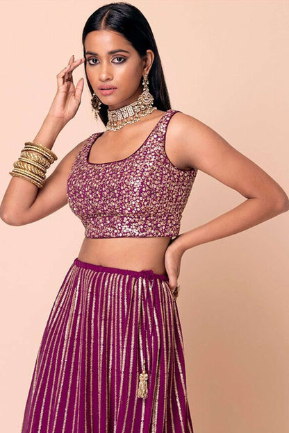 Back view ready to wear lehenga choli with embroidered finish
